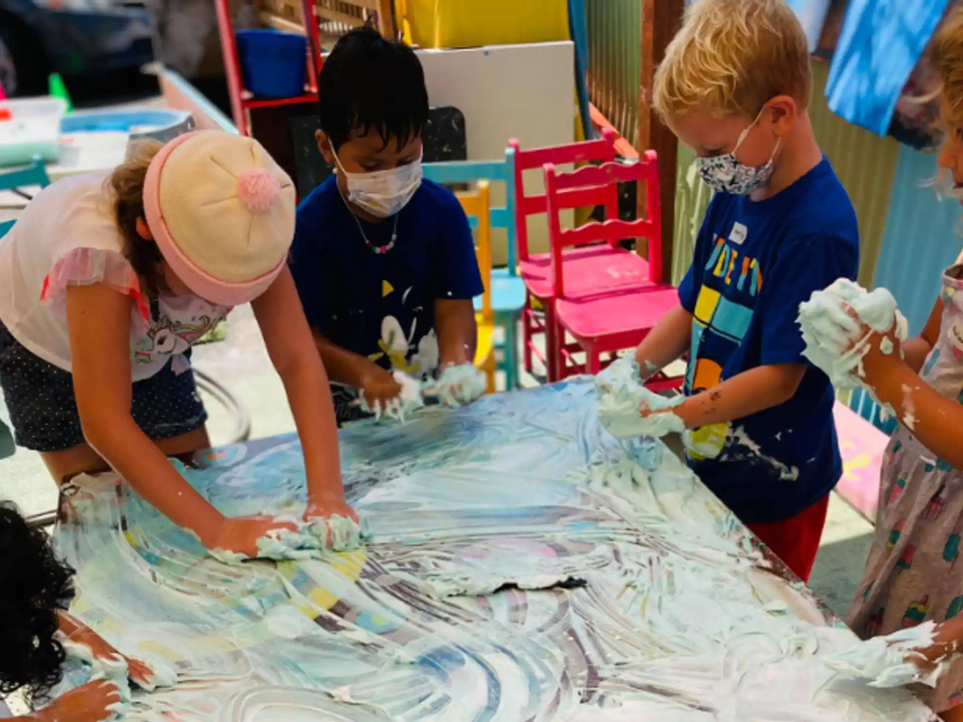 a group of children wearing masks