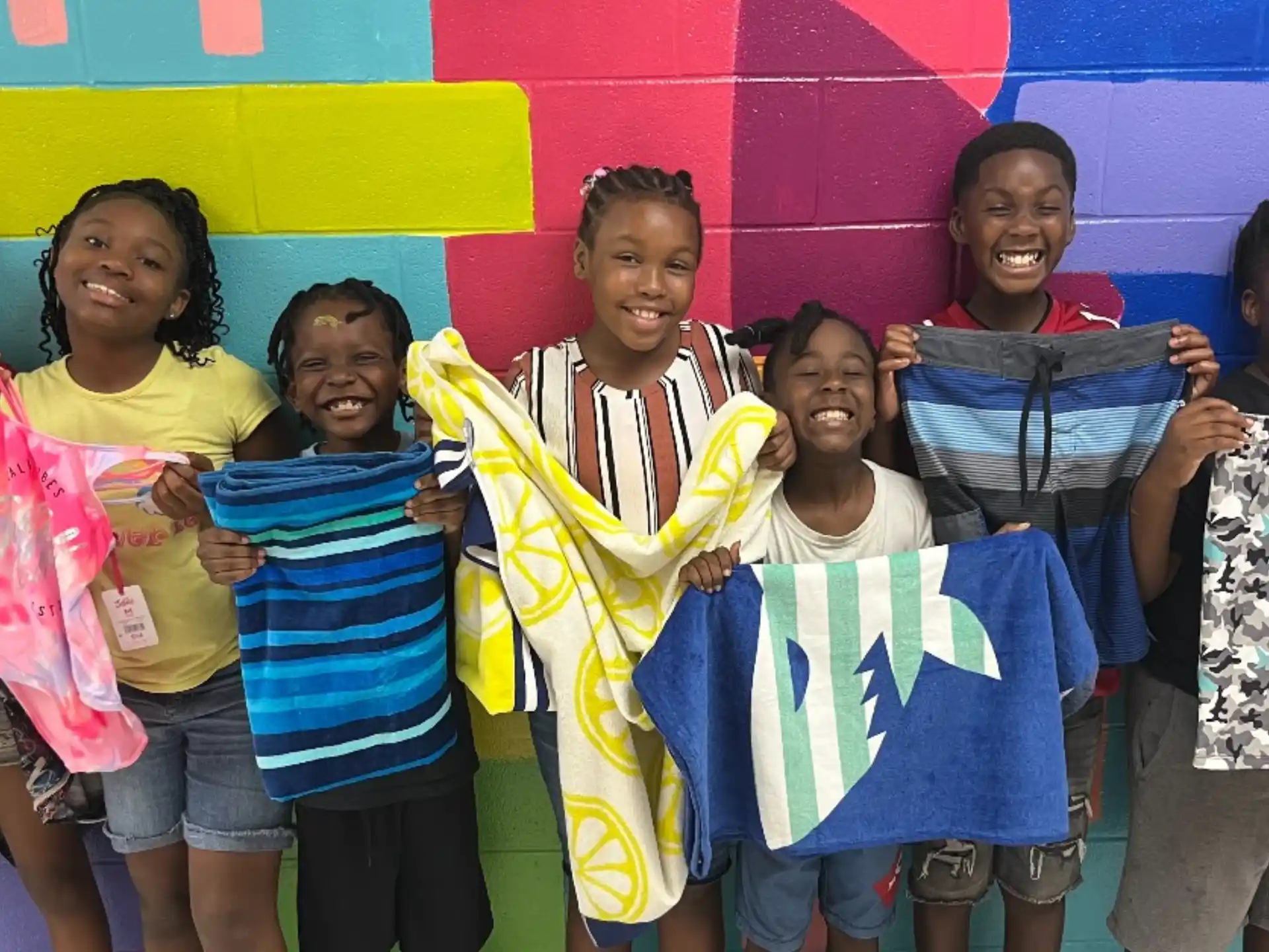 a group of children holding a flag