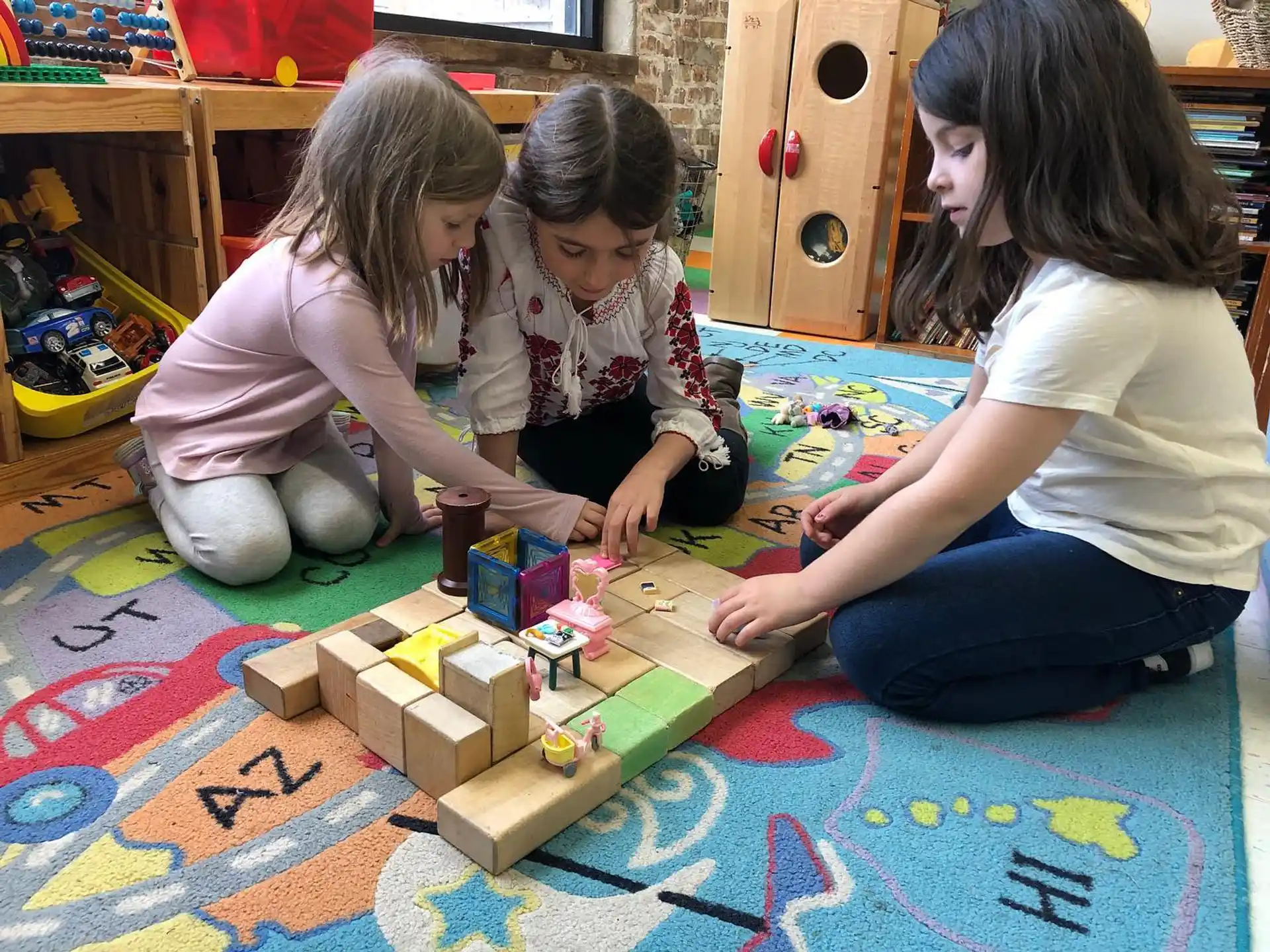 a group of children playing with toys