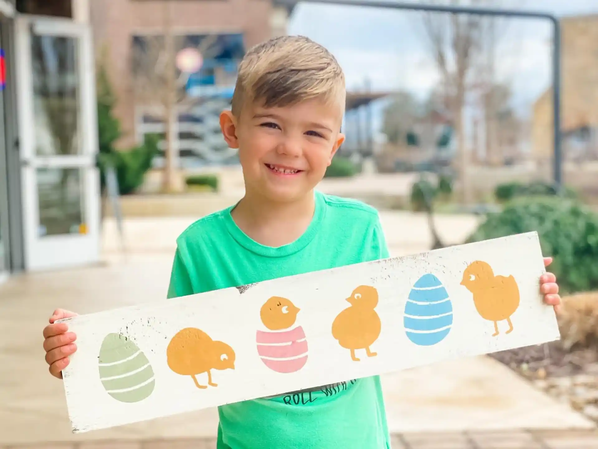 a boy holding a sign