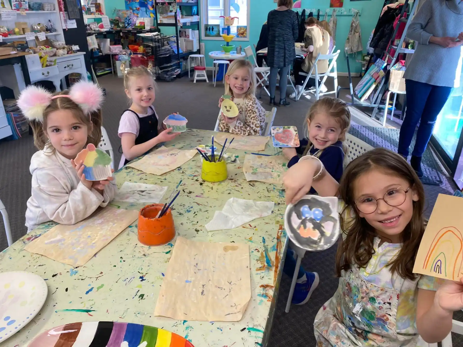 a group of children sitting at a table
