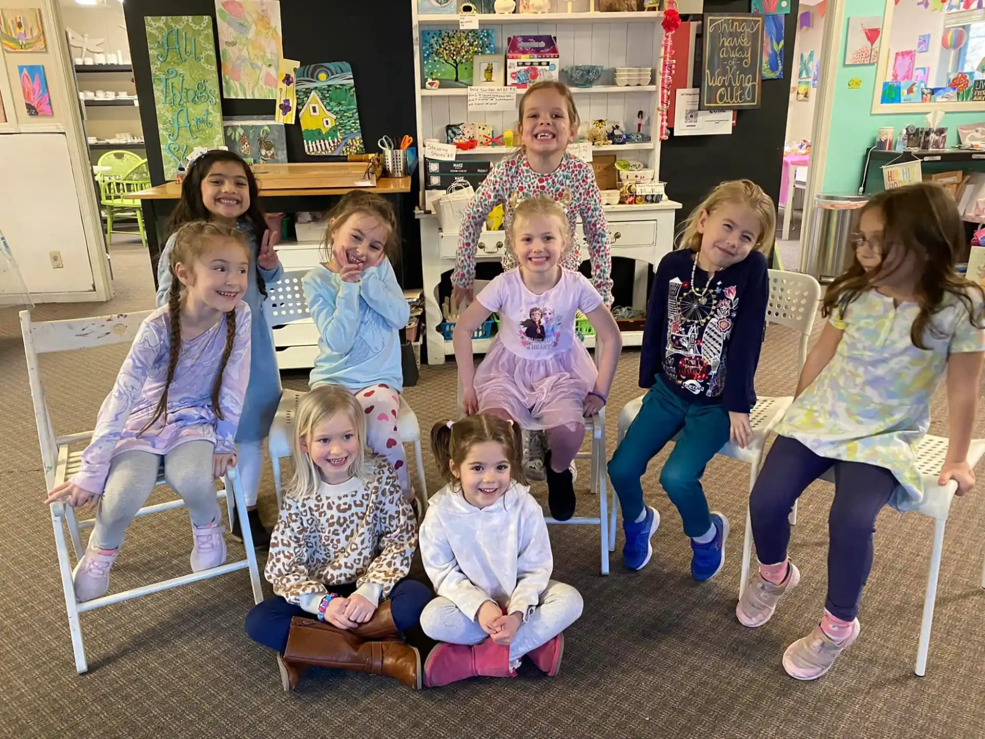 a group of children sitting in a classroom