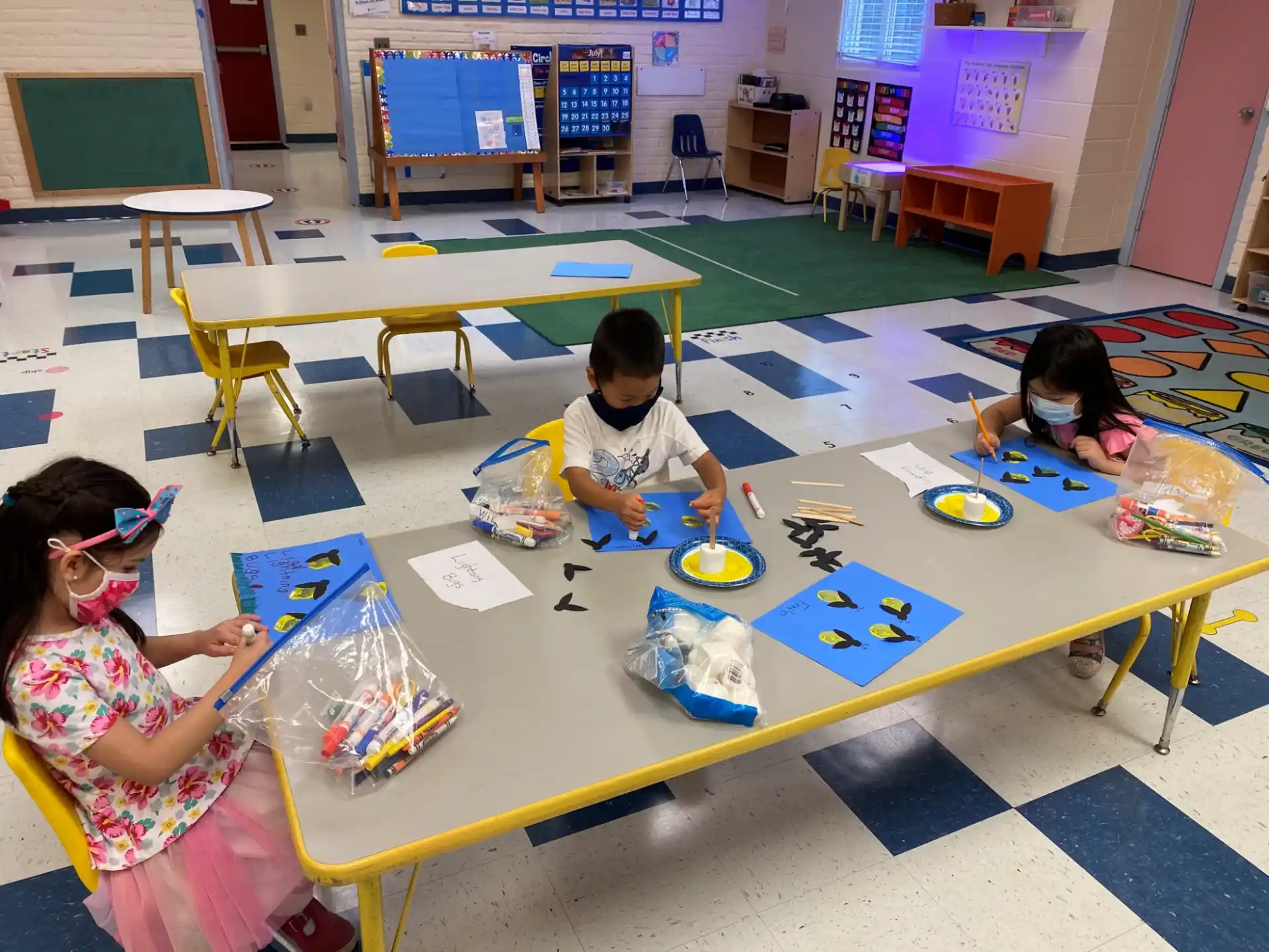 children painting on a table