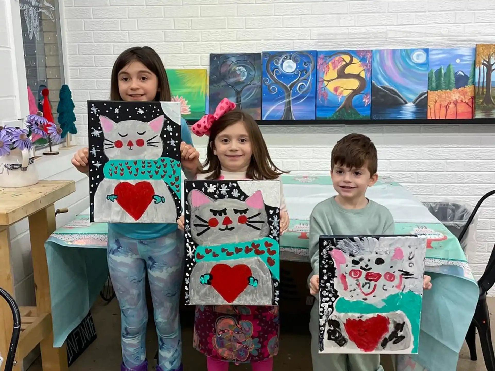 a group of children holding up posters