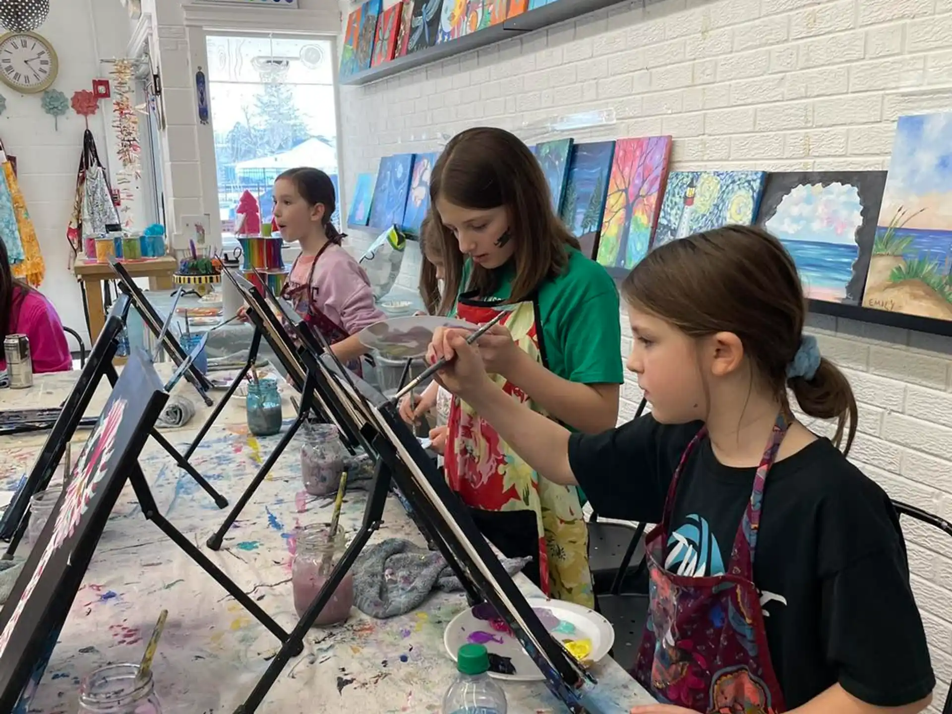 a group of girls painting