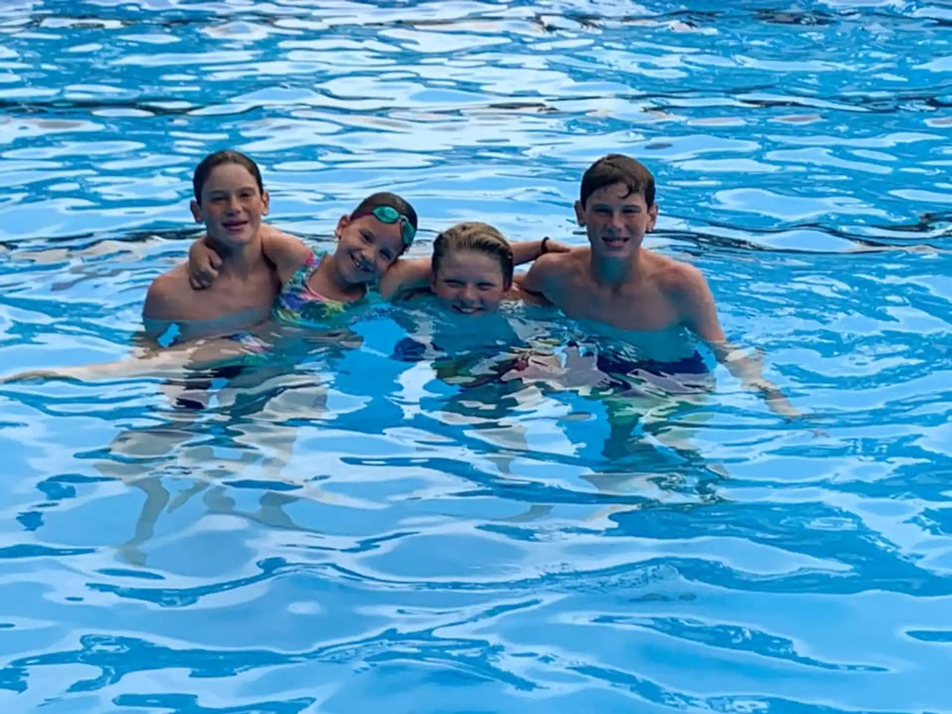 a group of people in a pool