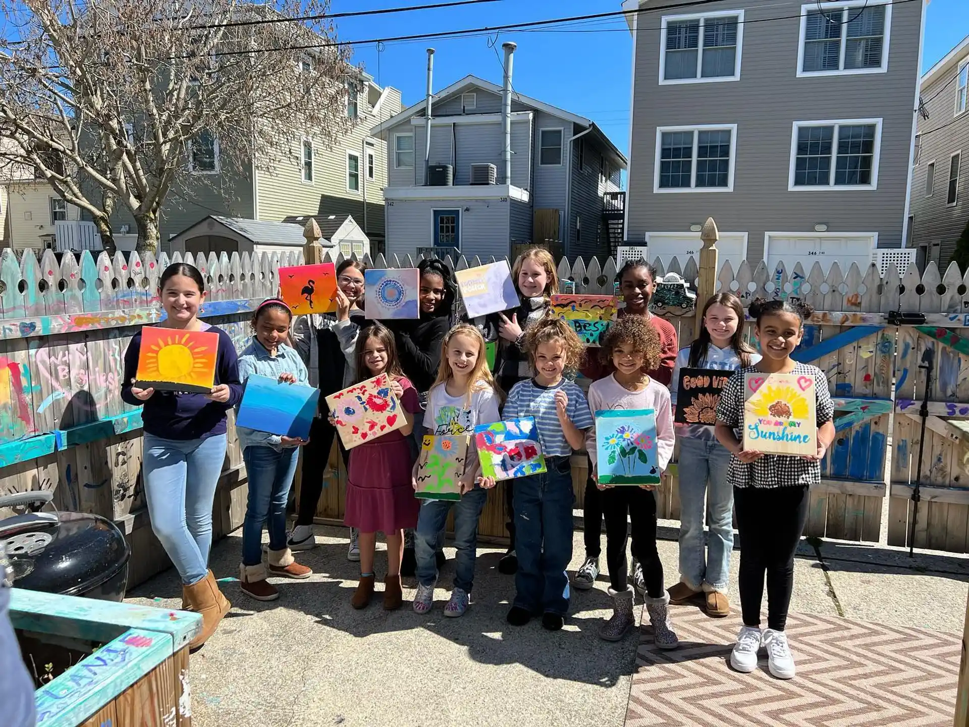 a group of children holding signs