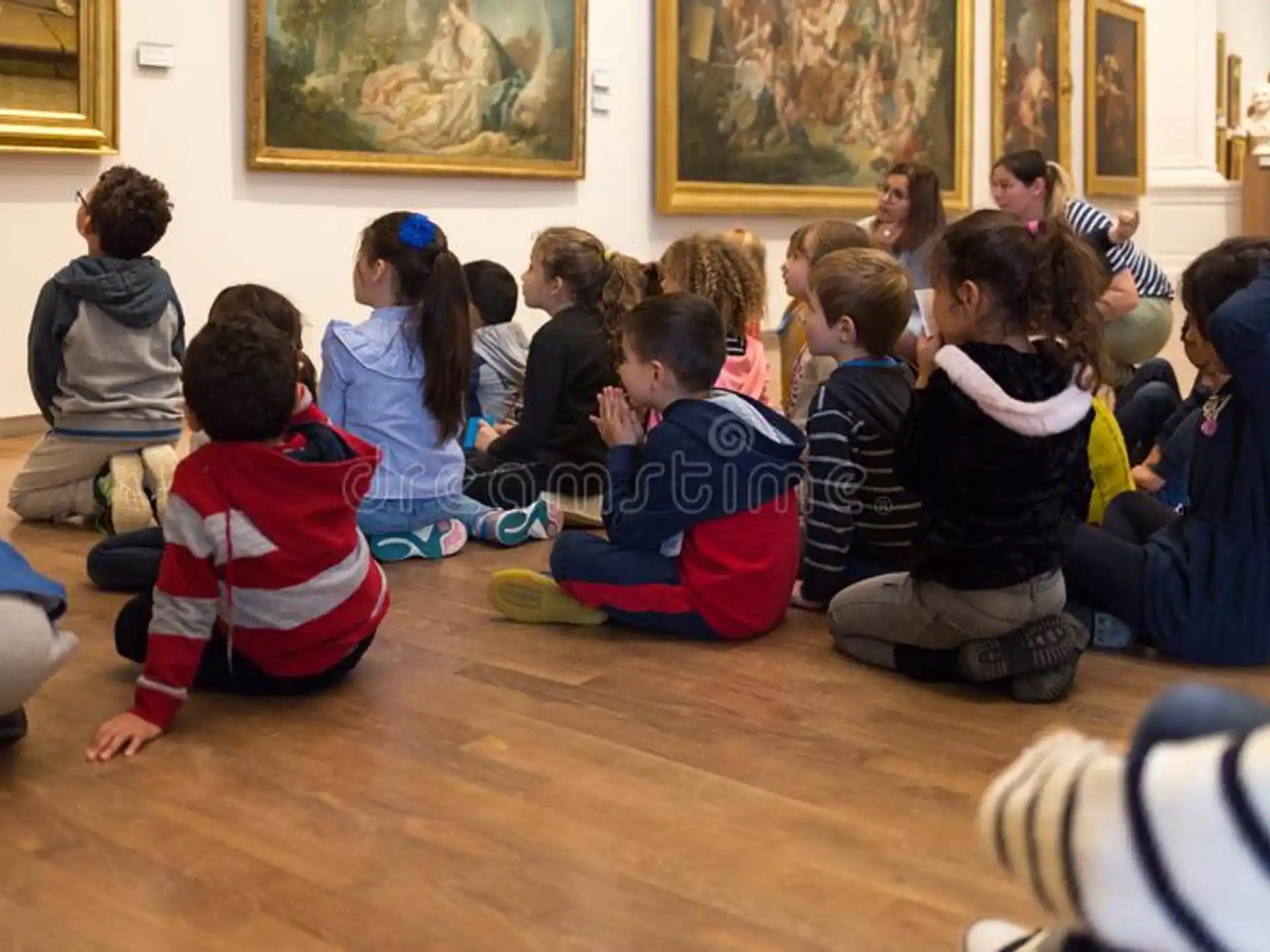 a group of children sitting on the floor