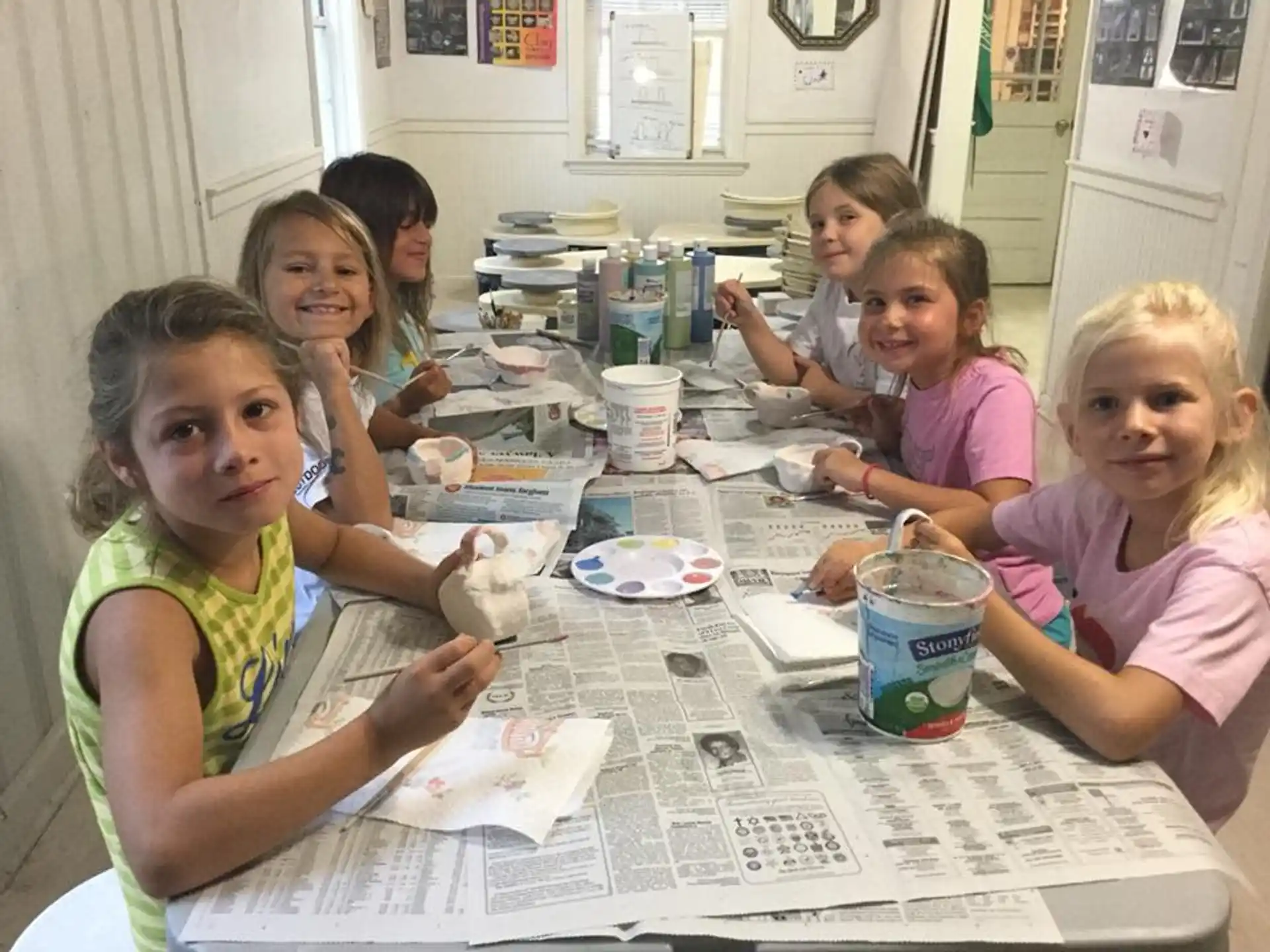 a group of children sitting at a table