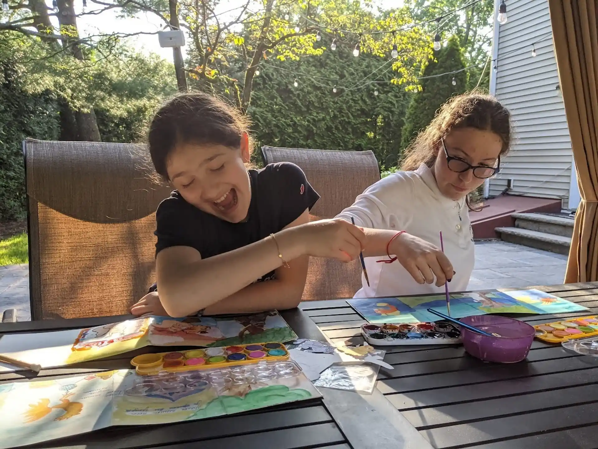 a person and a boy painting