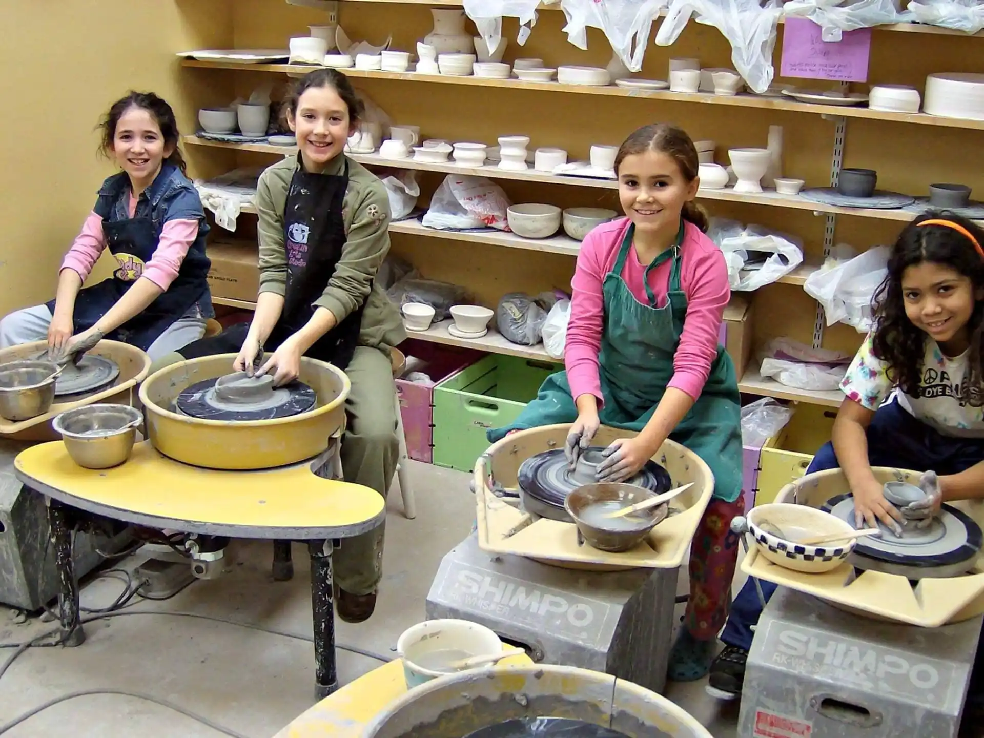 a group of women cooking in a kitchen