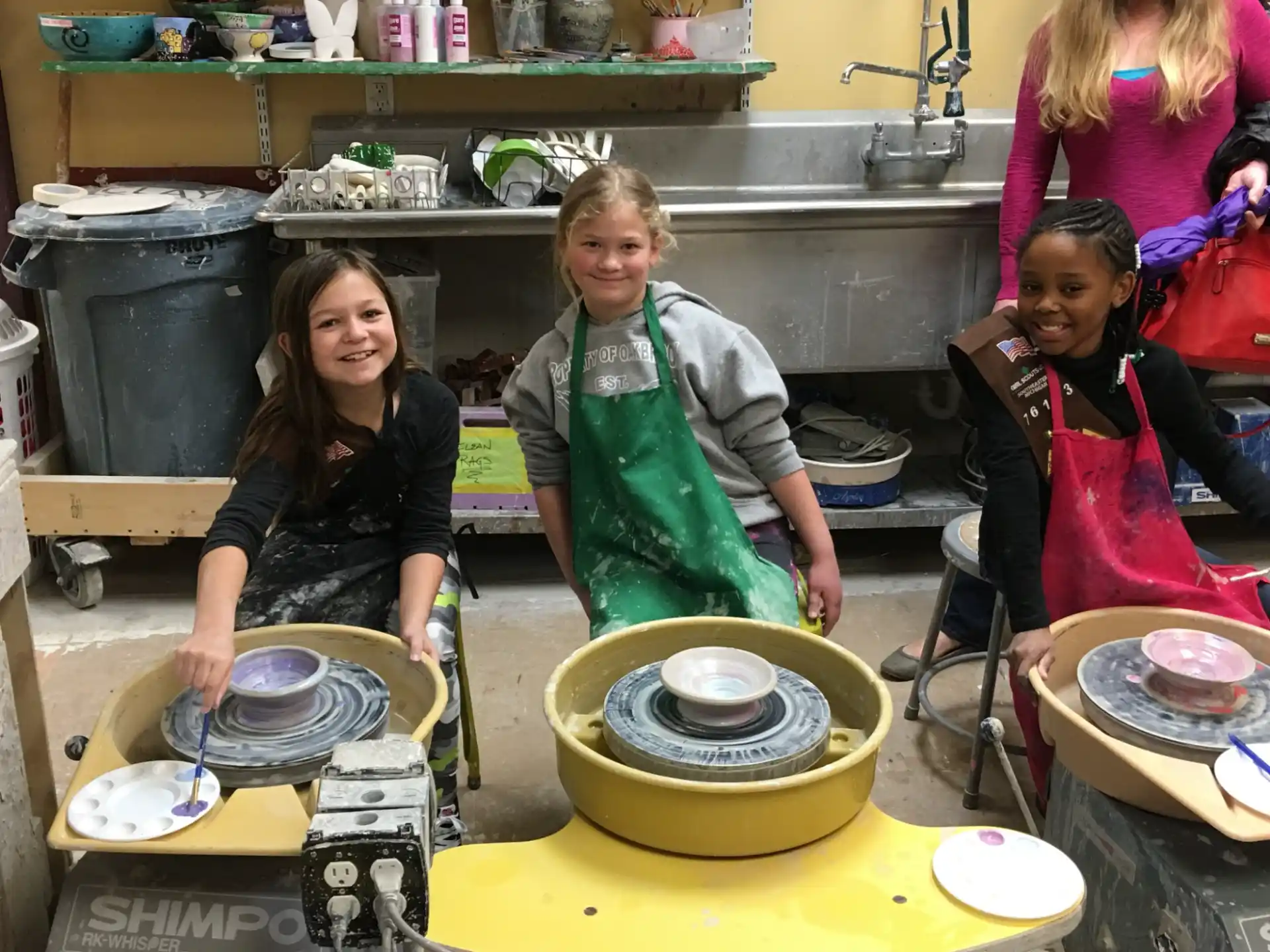 a group of women cooking in a kitchen