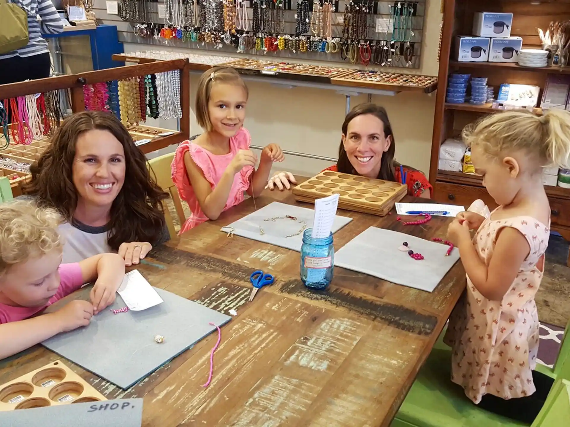 a group of children sitting at a table