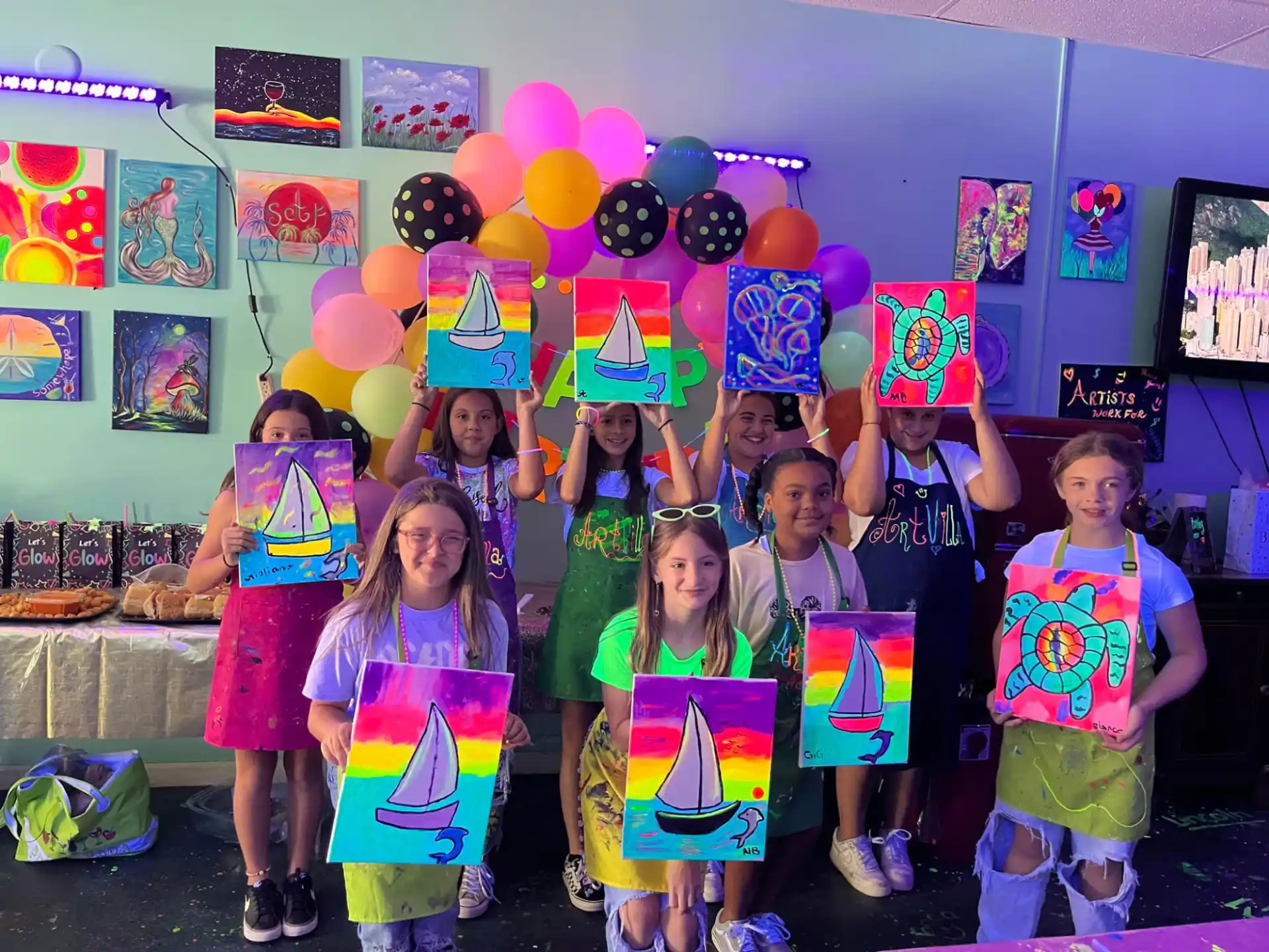 a group of children holding balloons