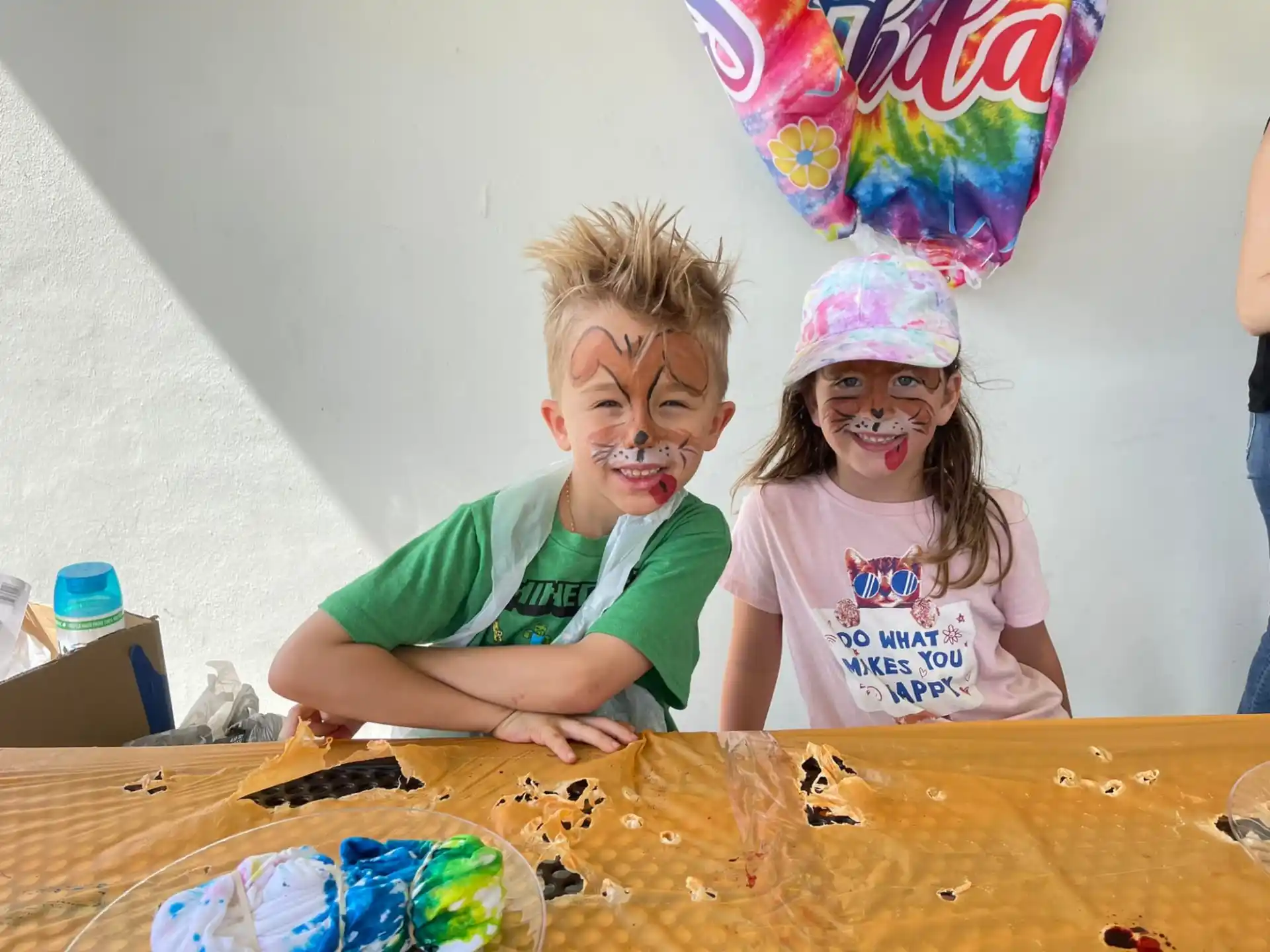 a group of children with paint on their faces