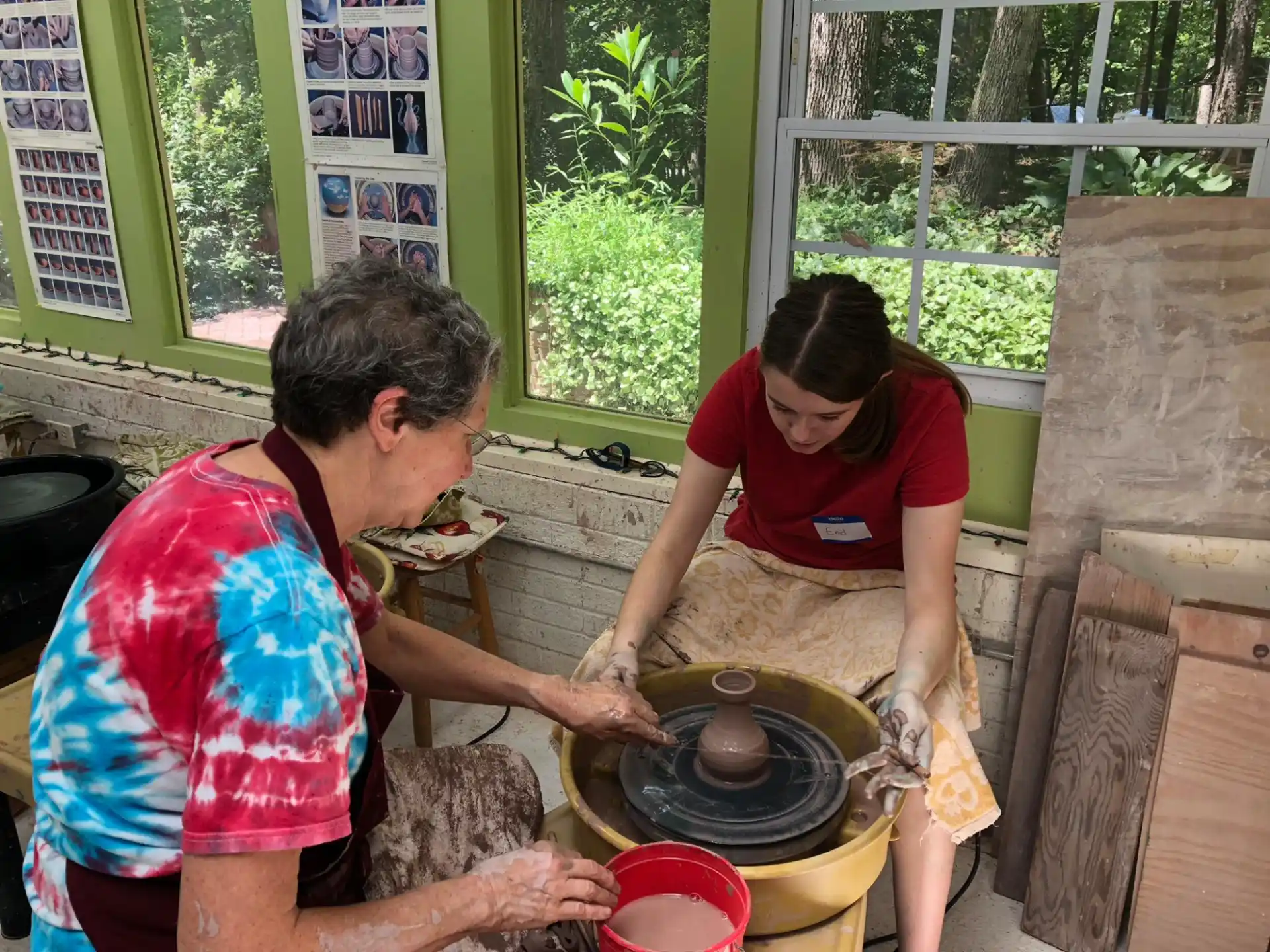 a group of people cooking in a kitchen