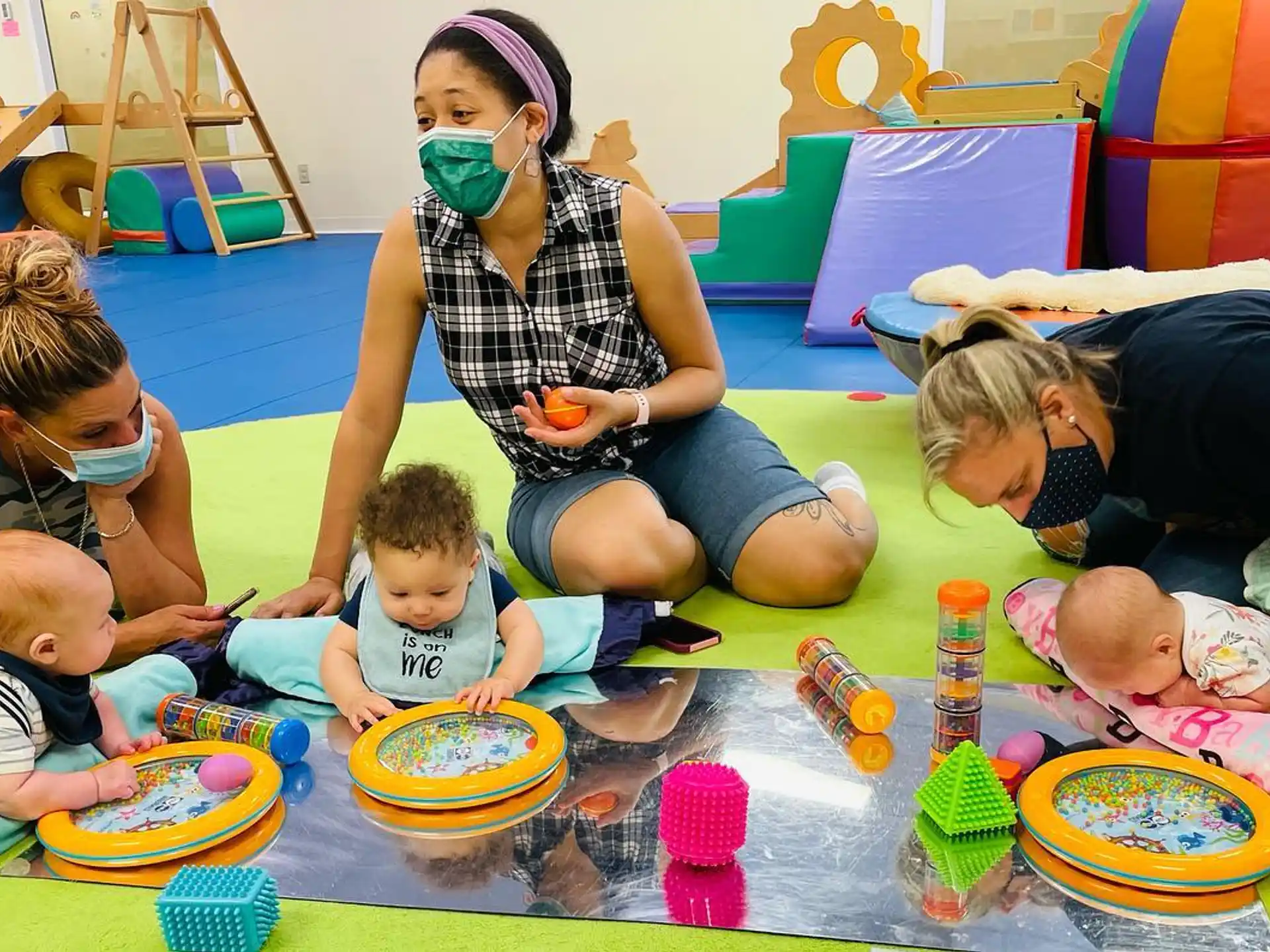 a group of people playing with toys