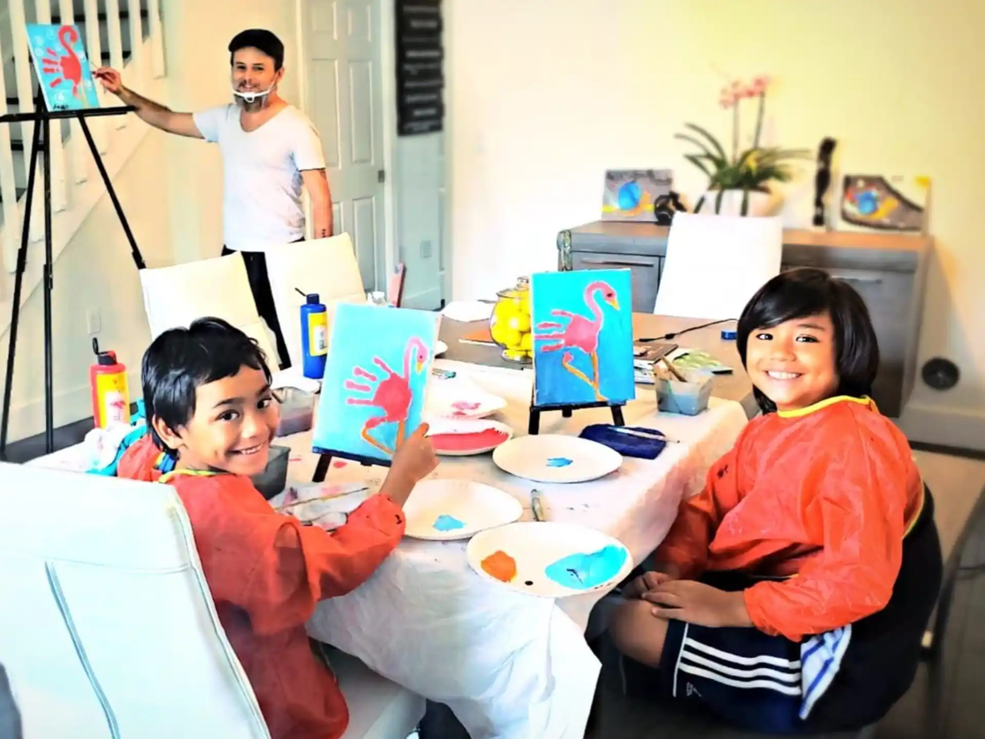 a group of people sitting around a table with food and drinks