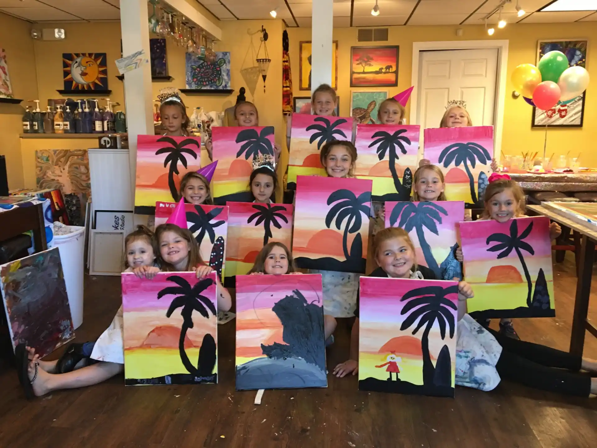 a group of children holding up posters