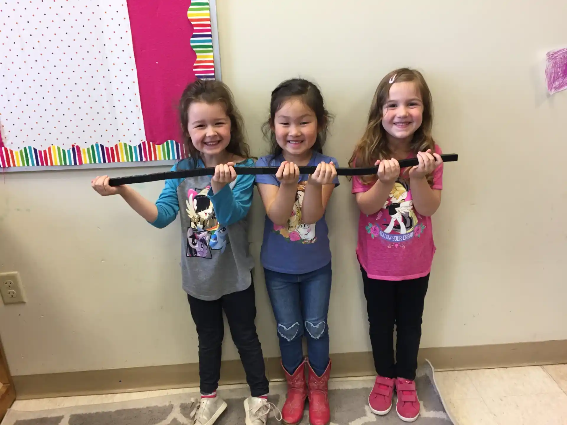 a group of girls holding up their hands