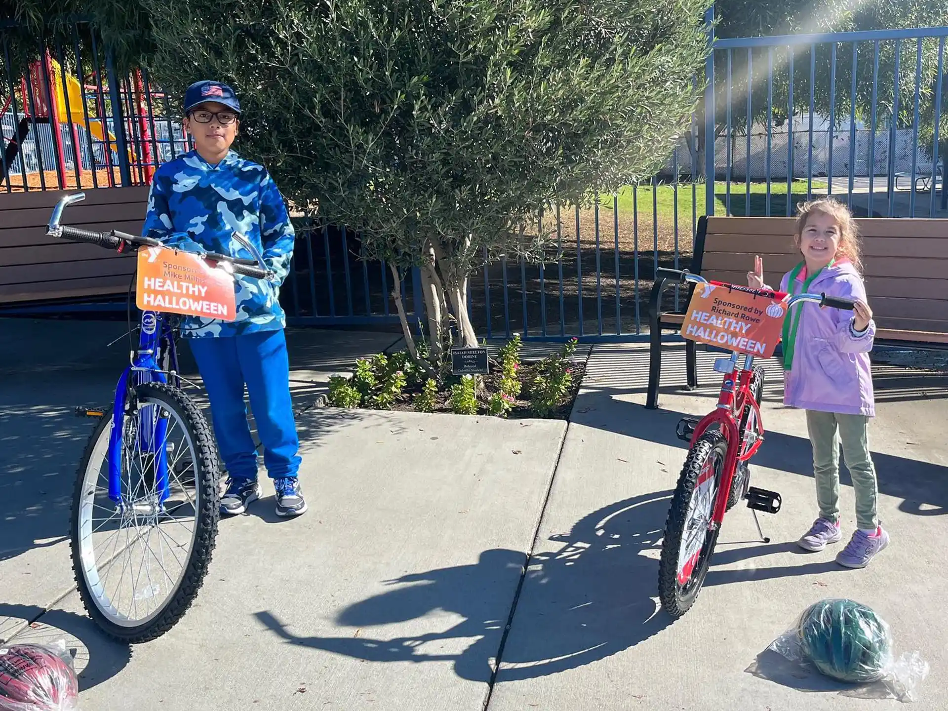 a boy and girl on bicycles