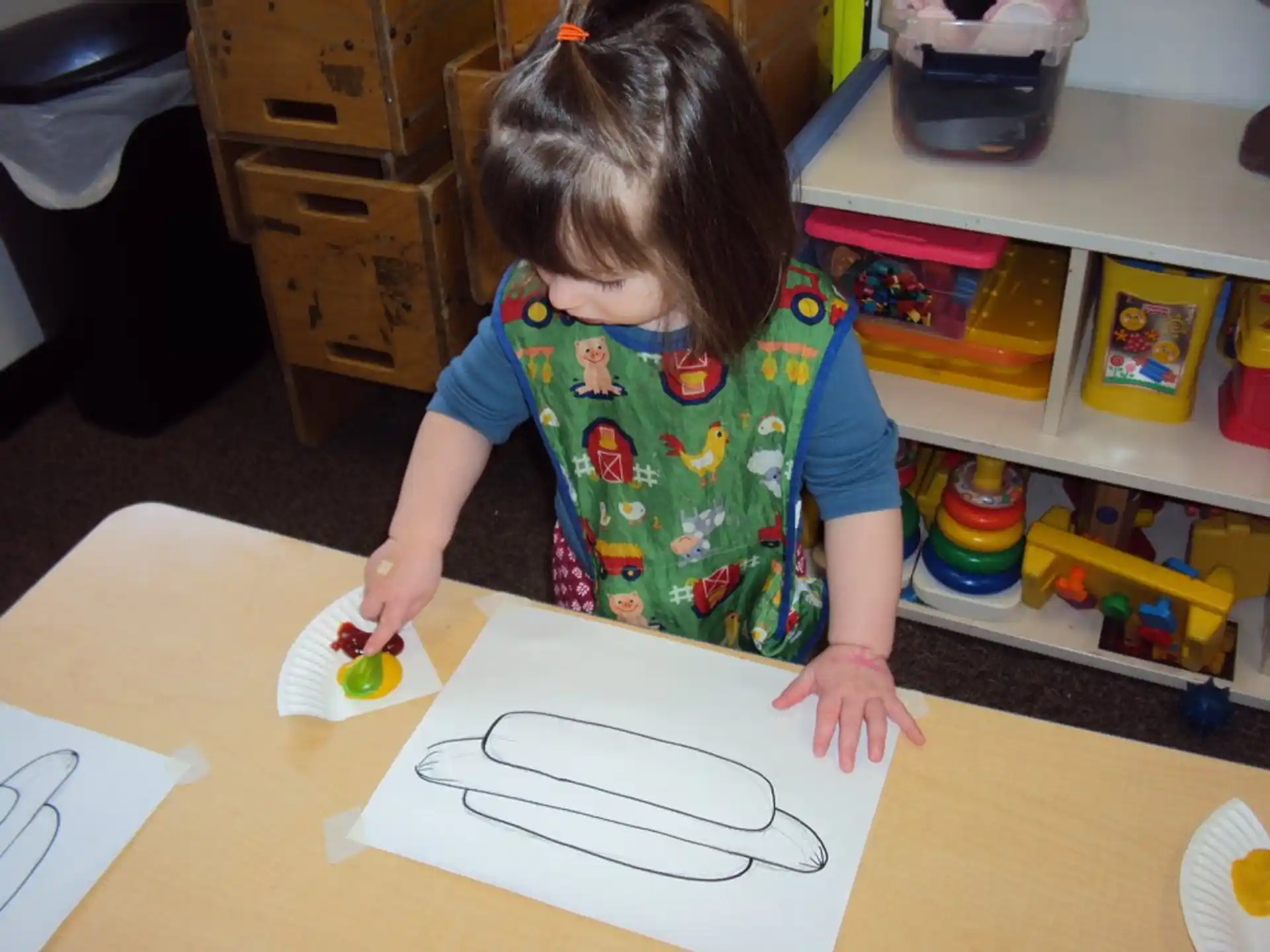 a child drawing on a paper