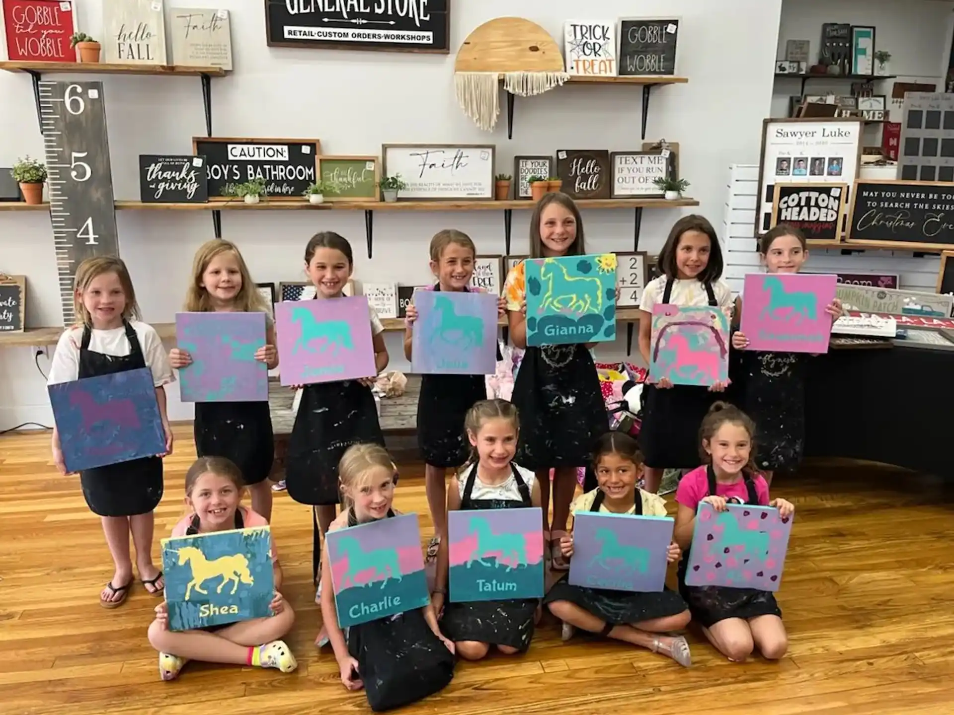 a group of children holding up signs