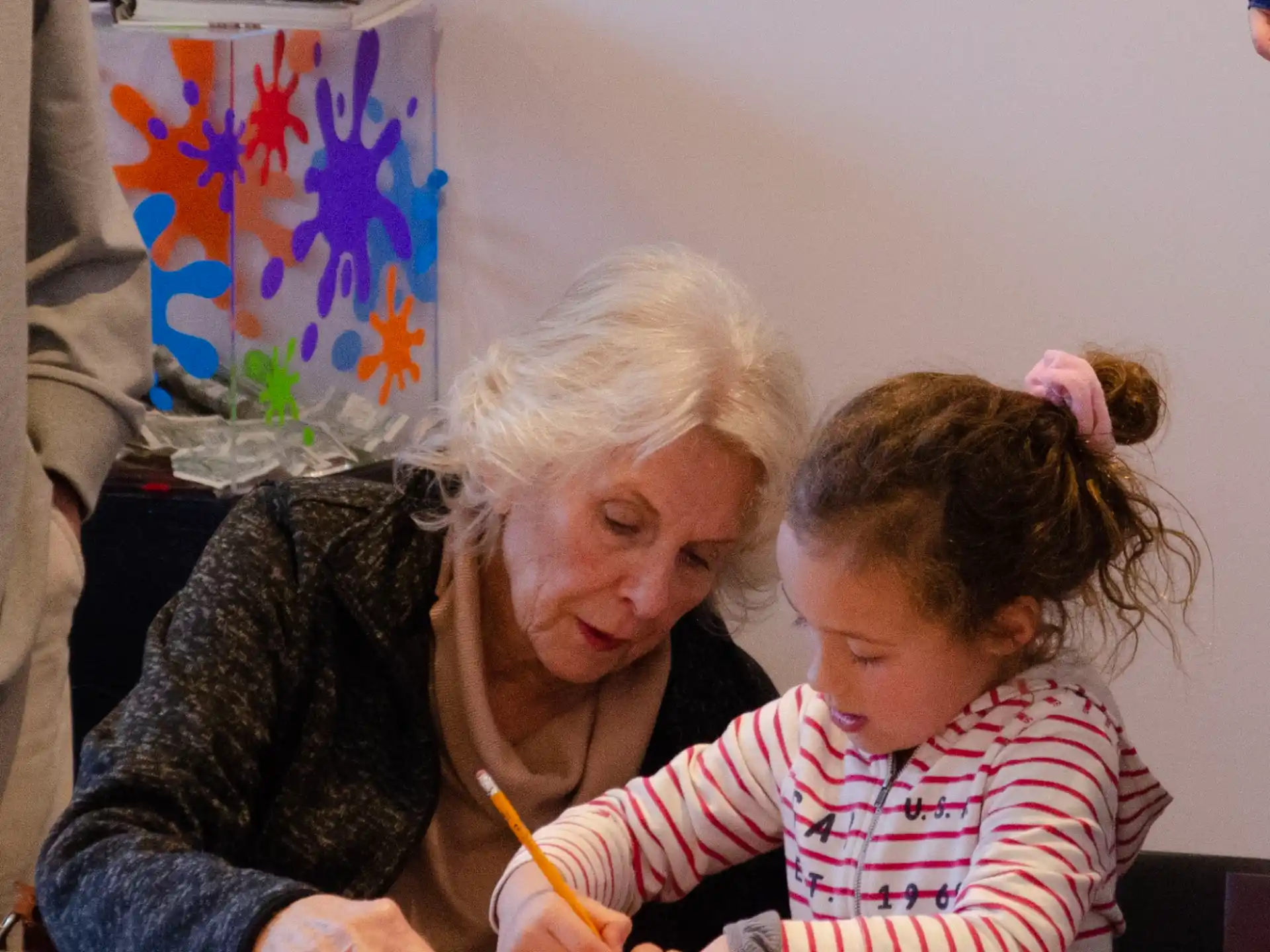 a man and a child sitting at a table