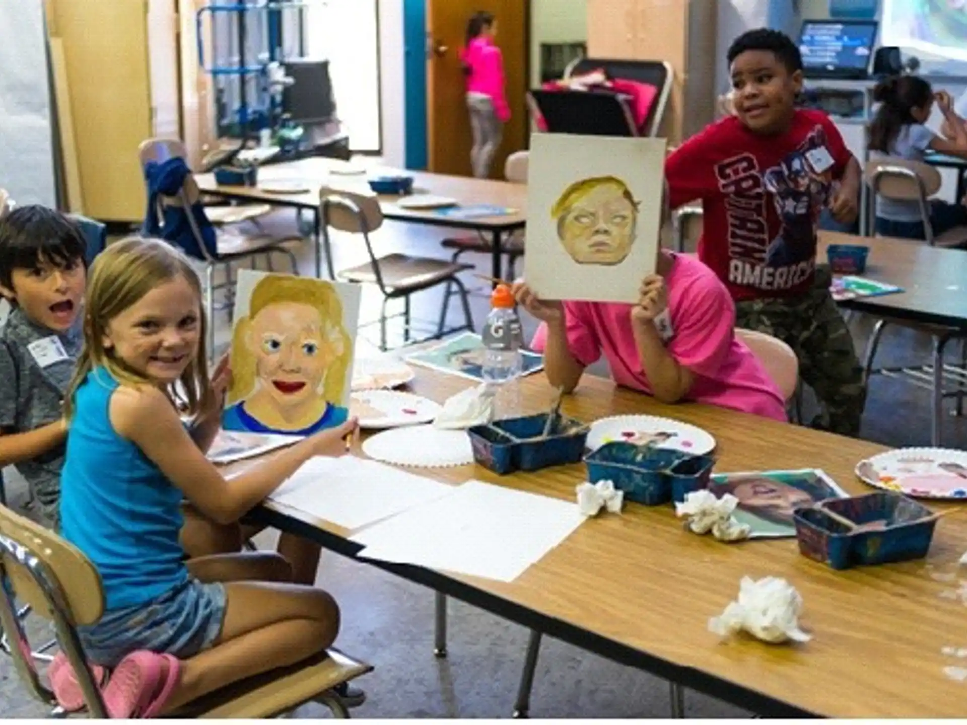 a group of children sitting at a table with toys