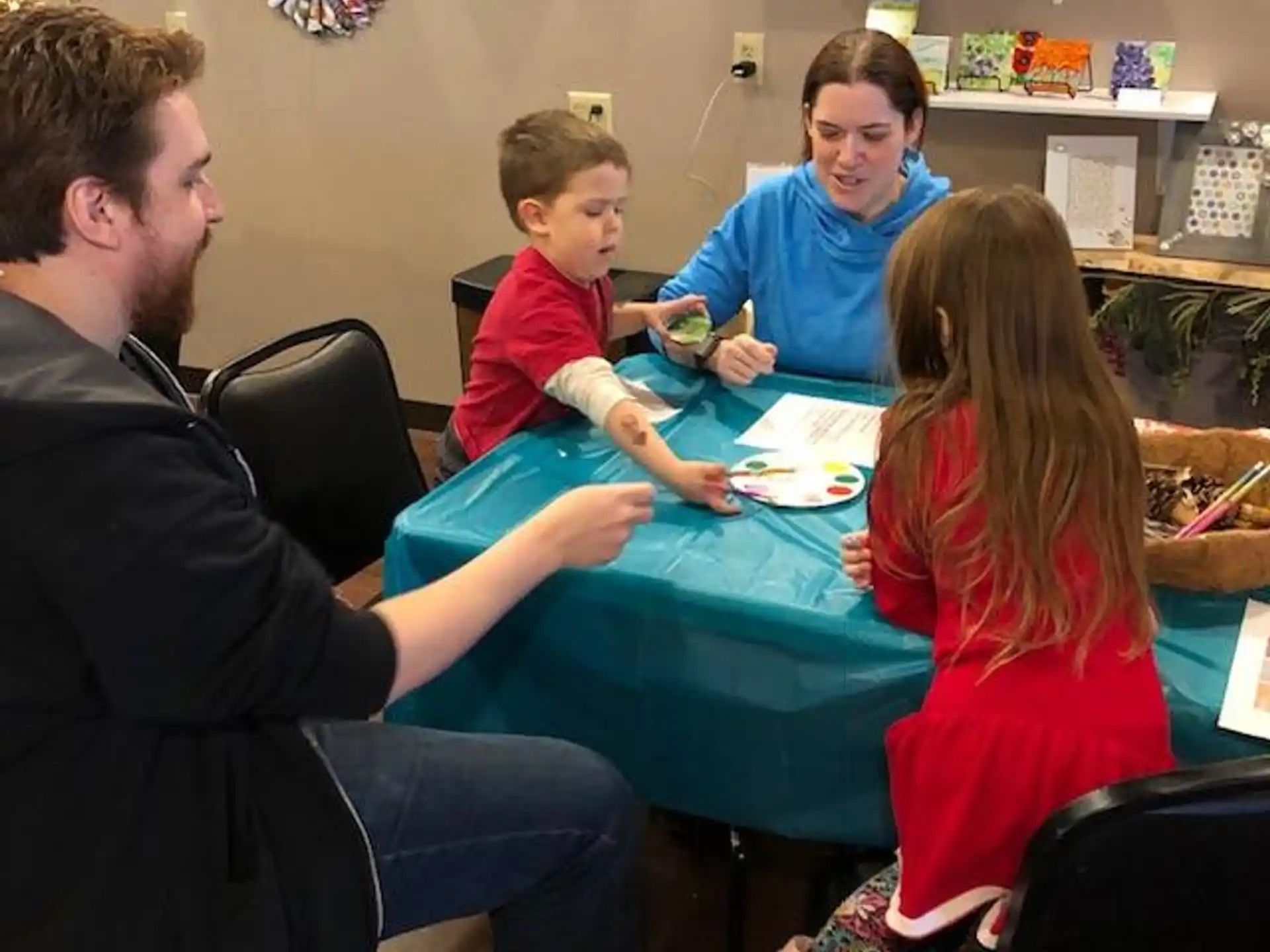 a group of people sitting around a table