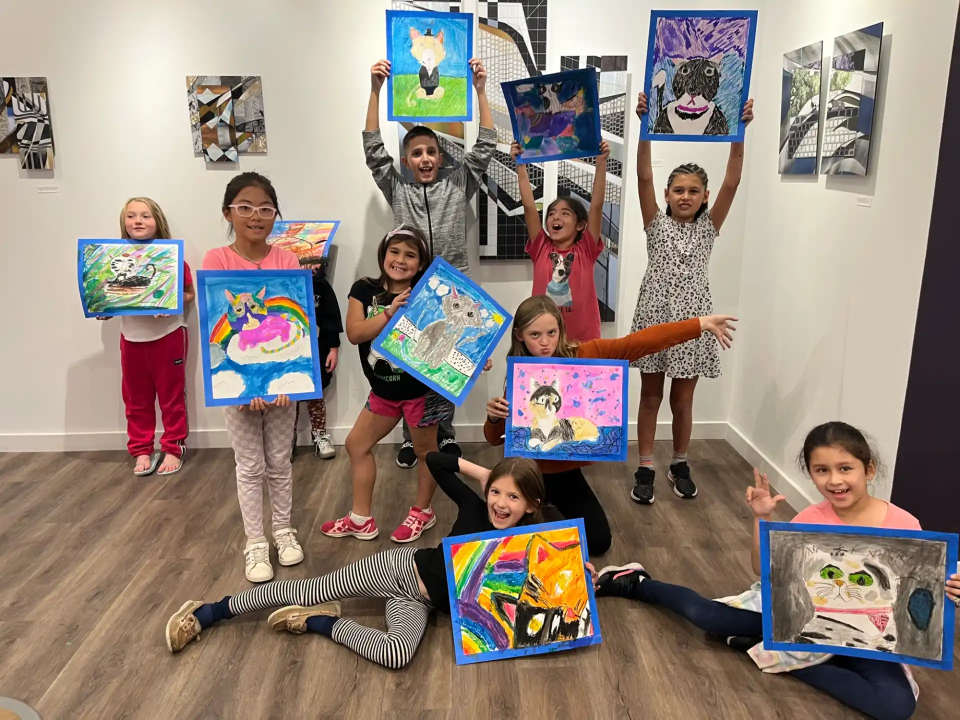 a group of children holding up posters