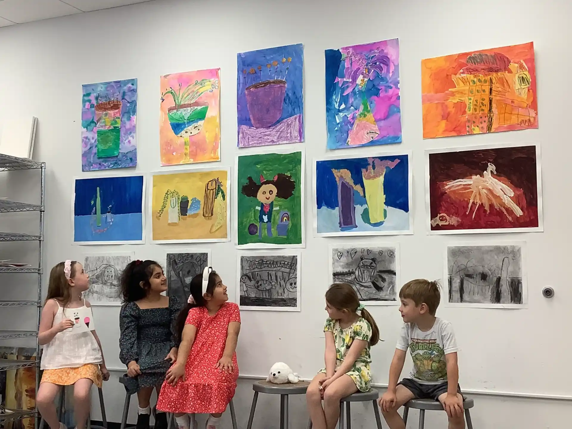 a group of children sitting in a classroom