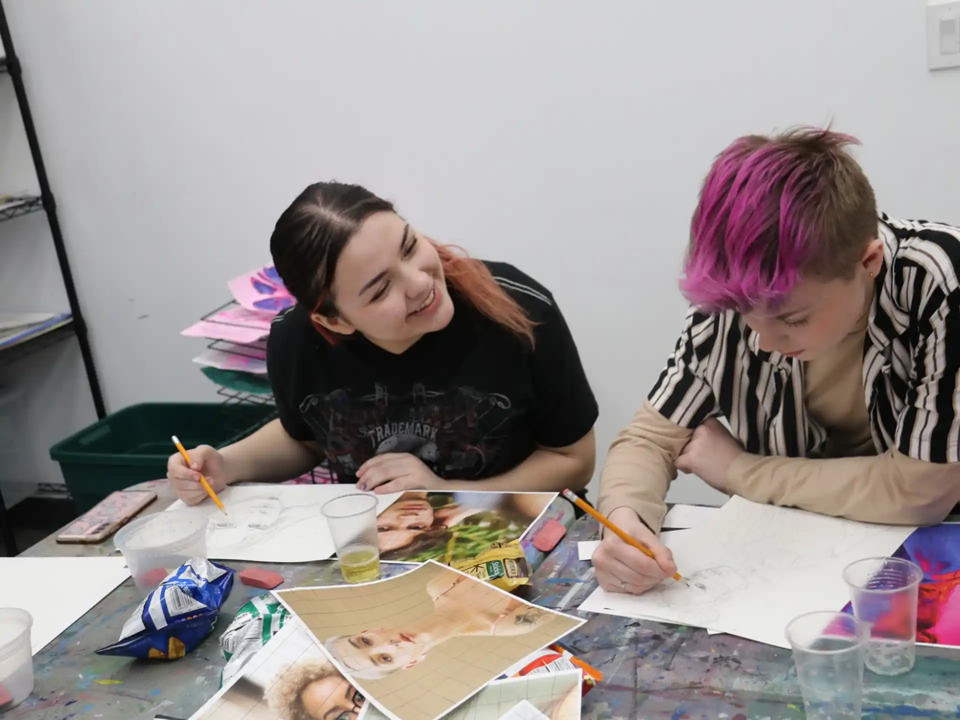 a man and woman painting