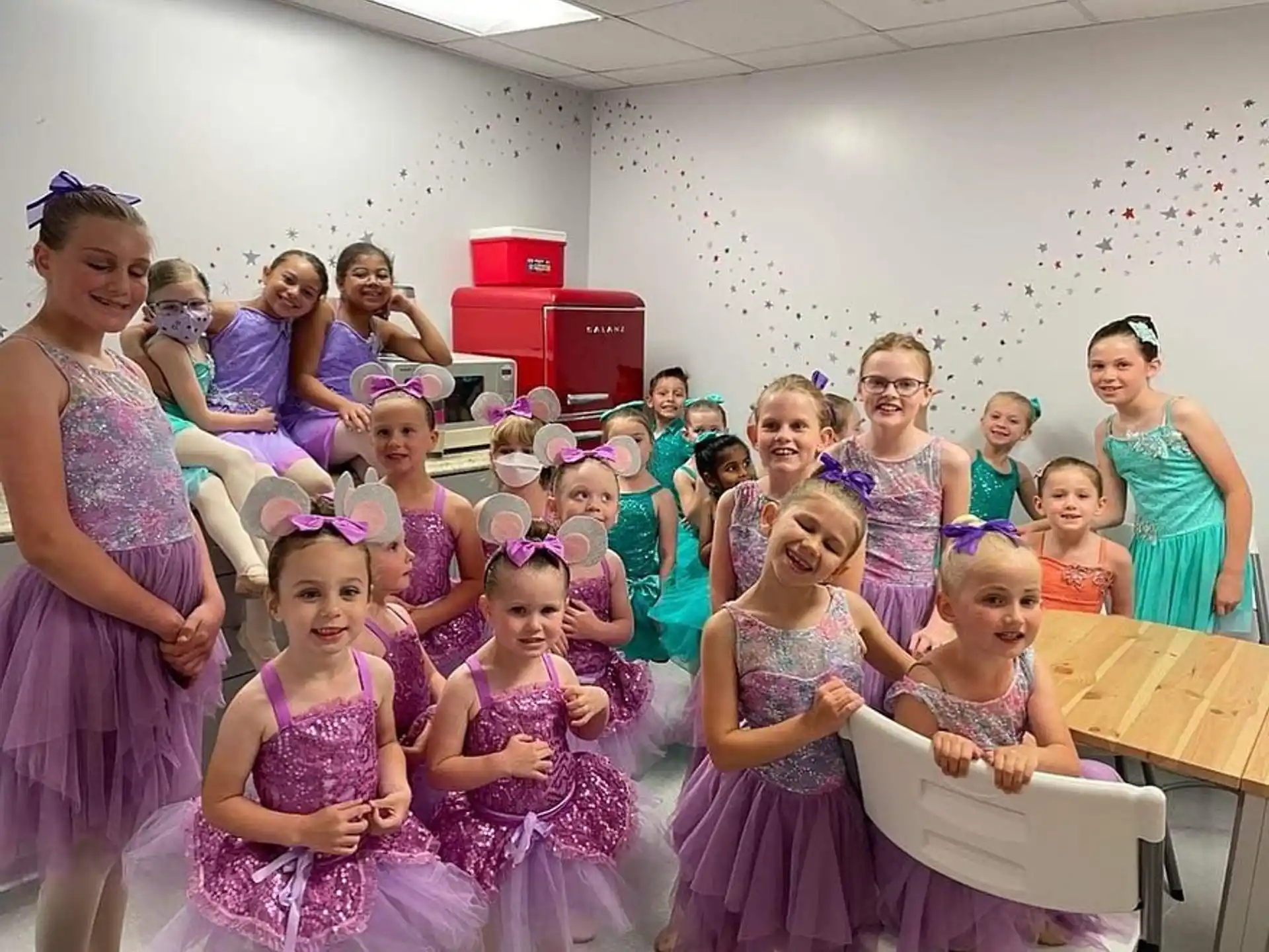 a group of people in dresses