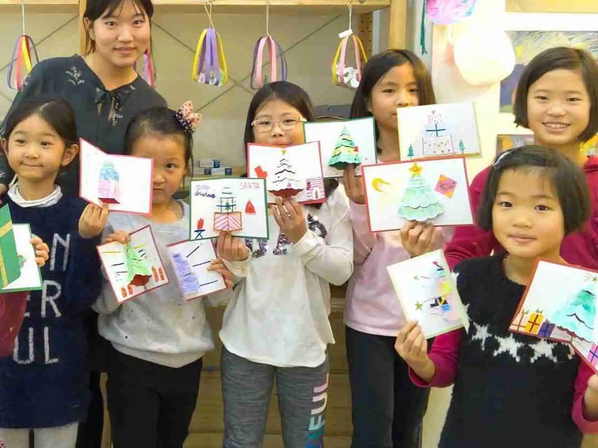 a group of children holding books