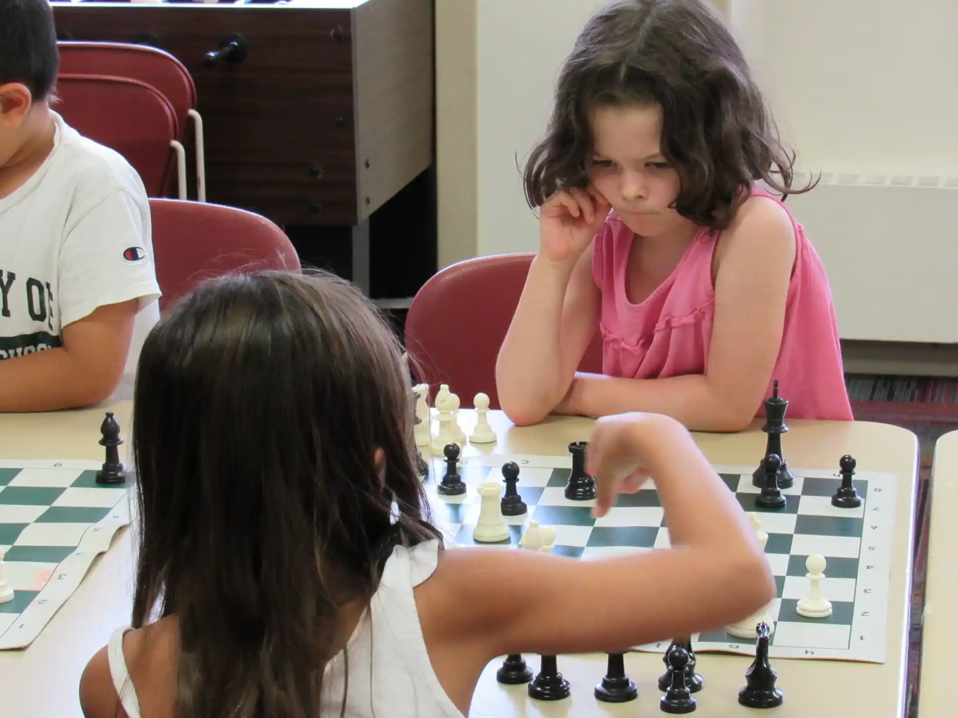a group of people playing chess