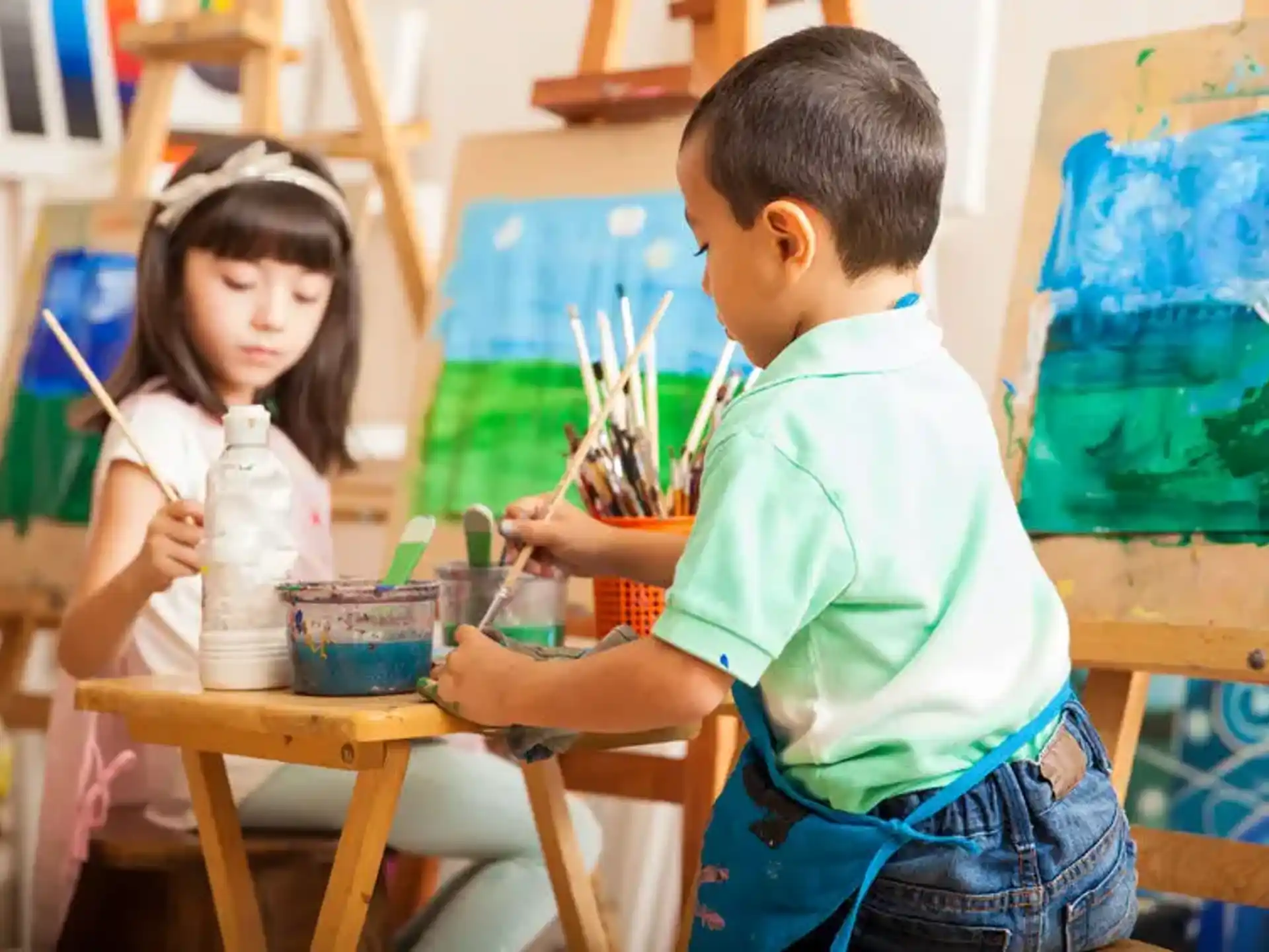 a boy and girl painting
