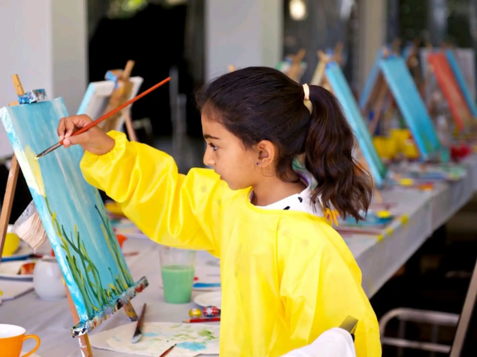 a young girl painting