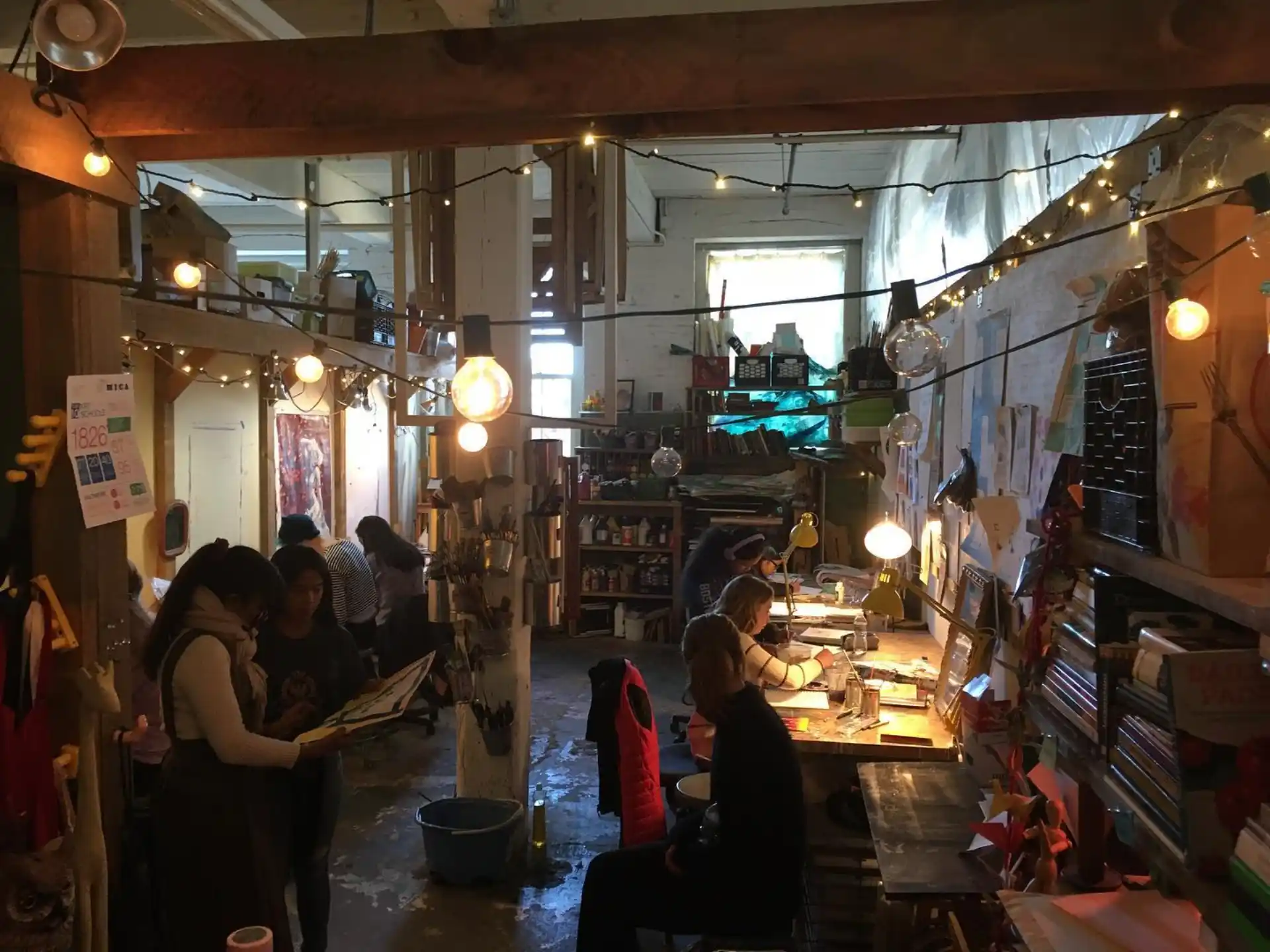 people in a room with shelves