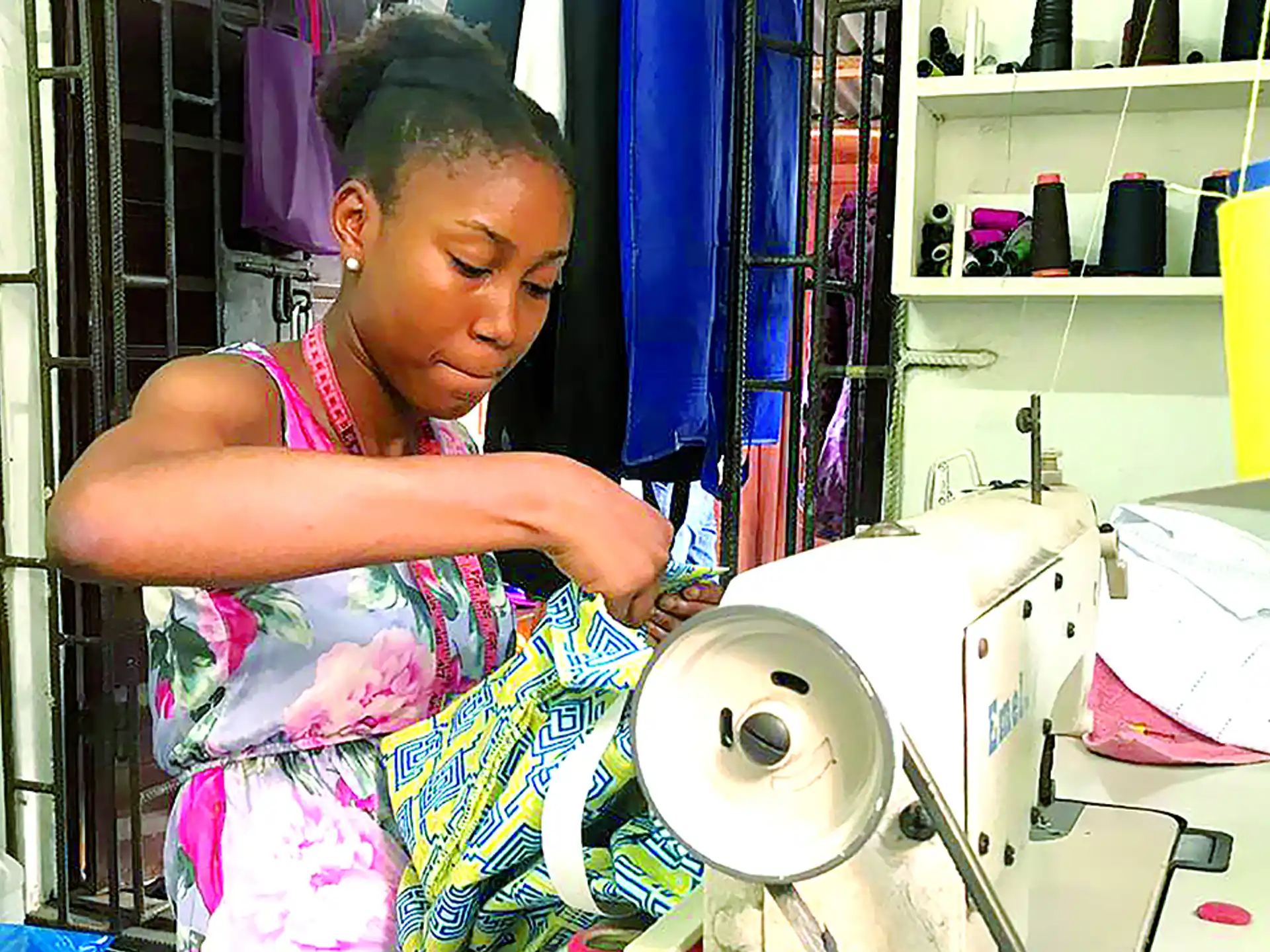 a person sewing clothes