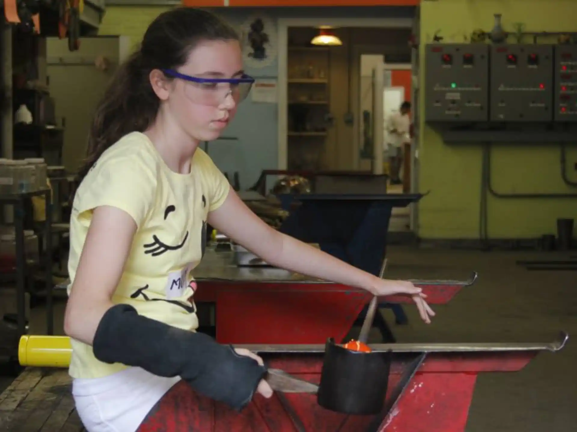 a woman working on a machine