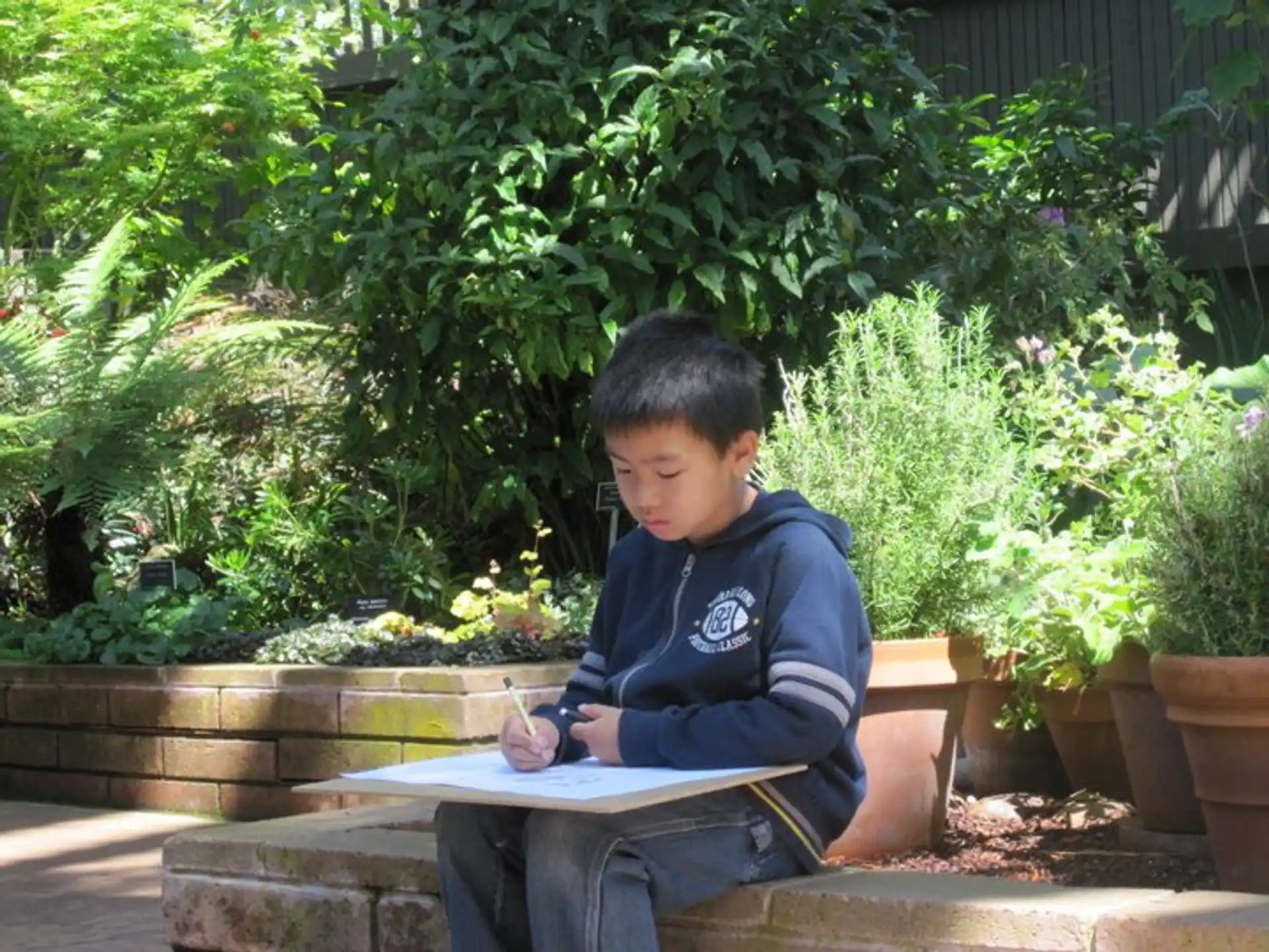 a boy sitting on a bench