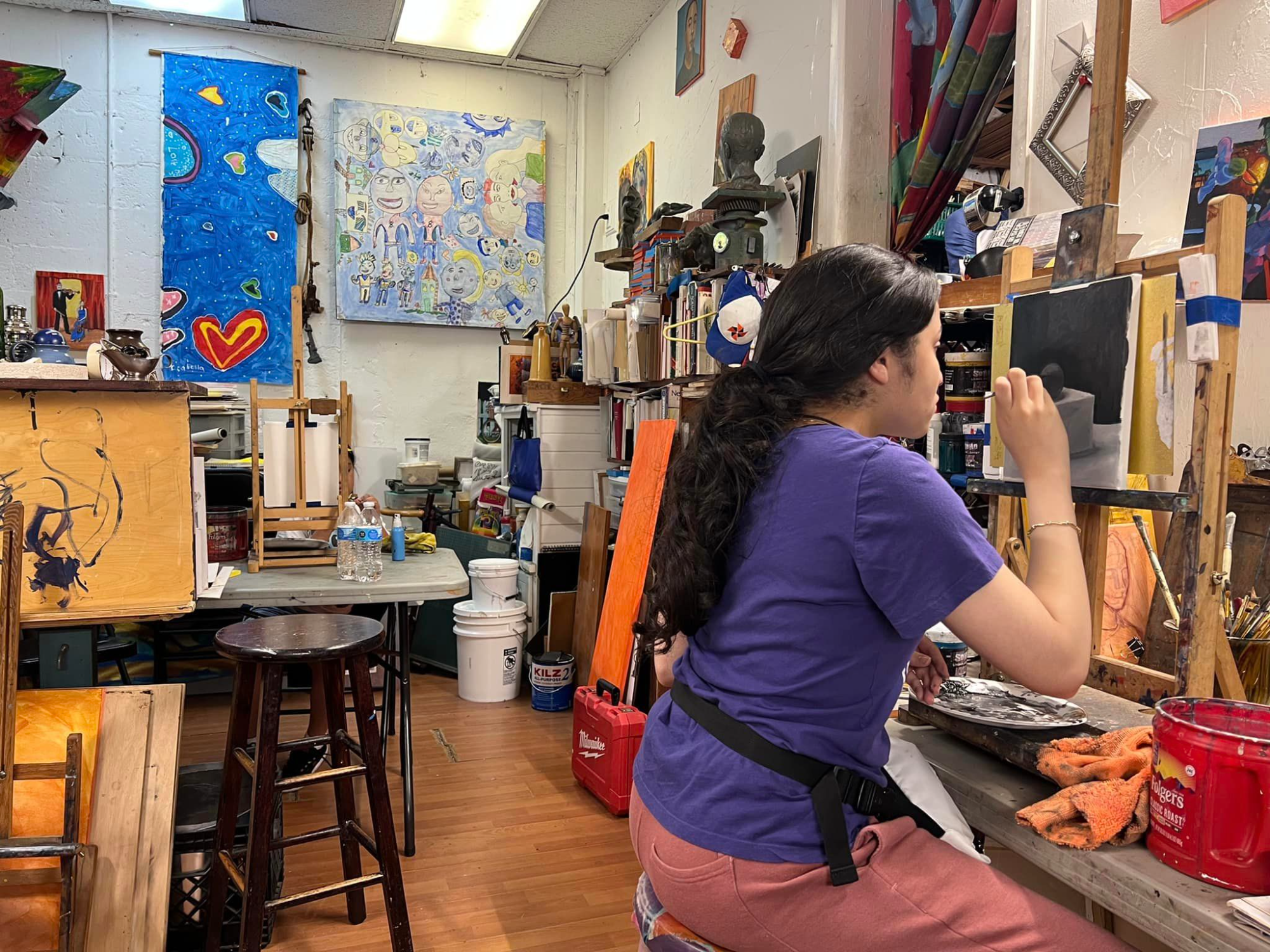a person painting in a room