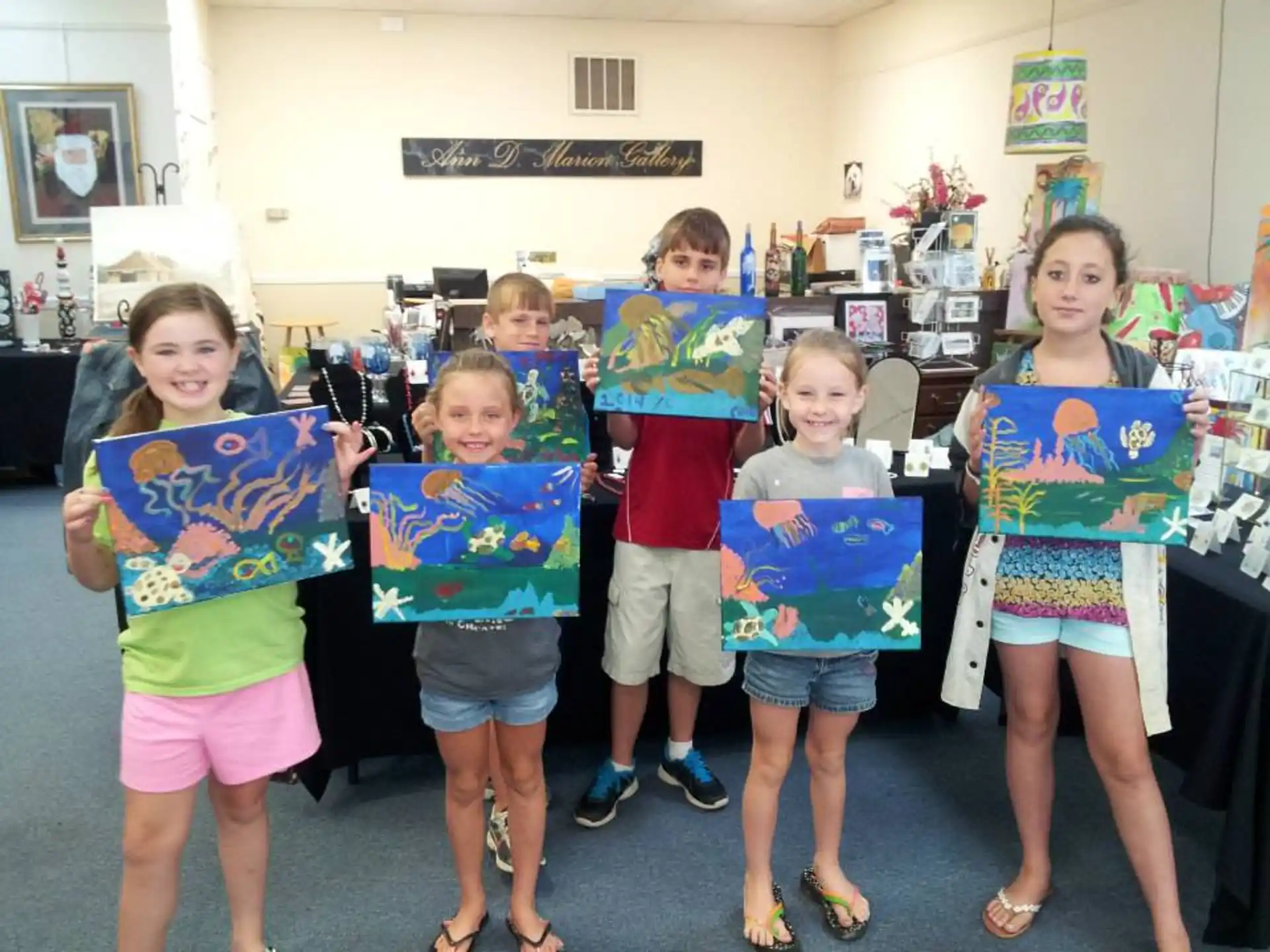 a group of children holding up signs