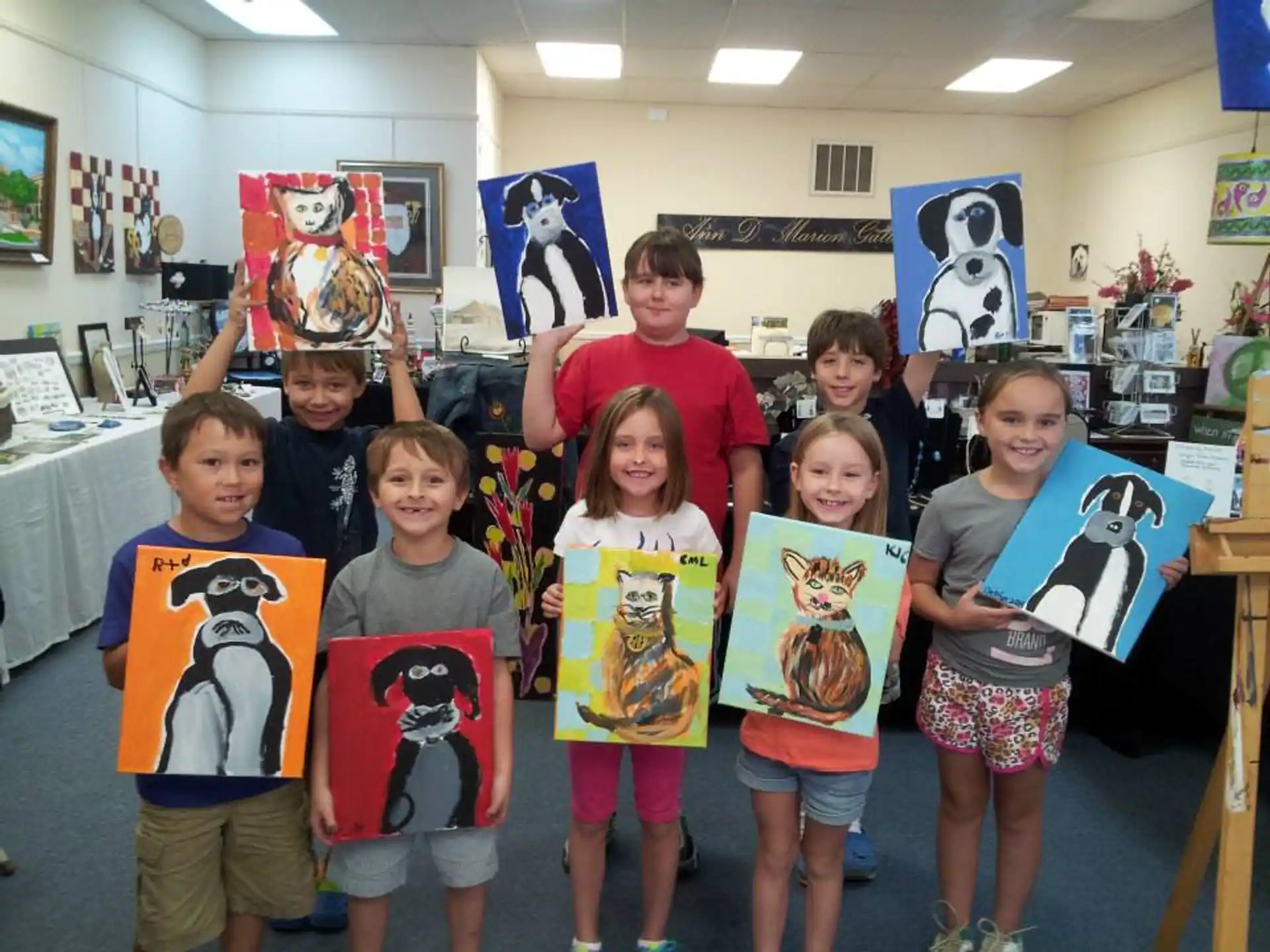 a group of kids holding up signs