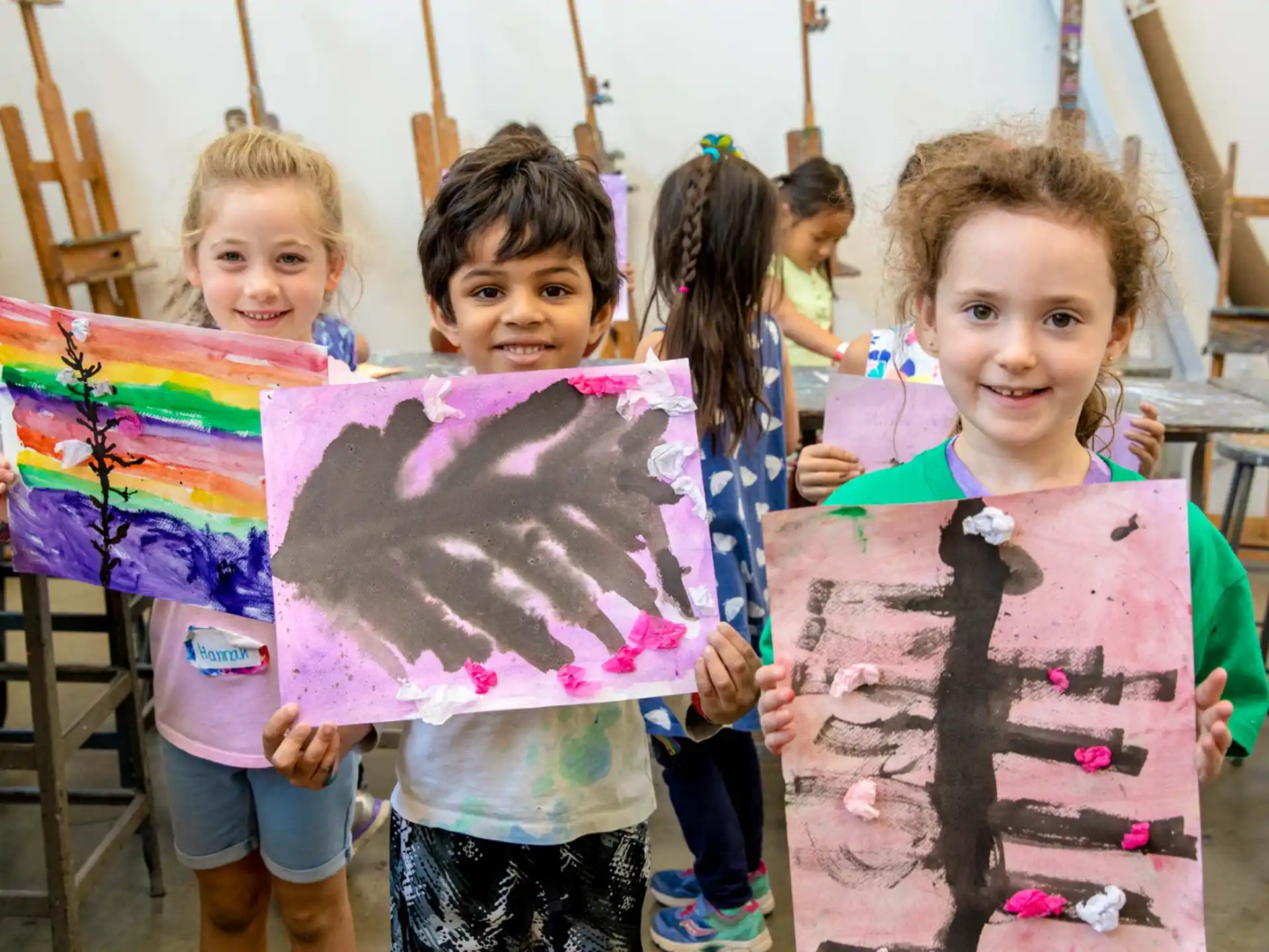 a group of children holding signs