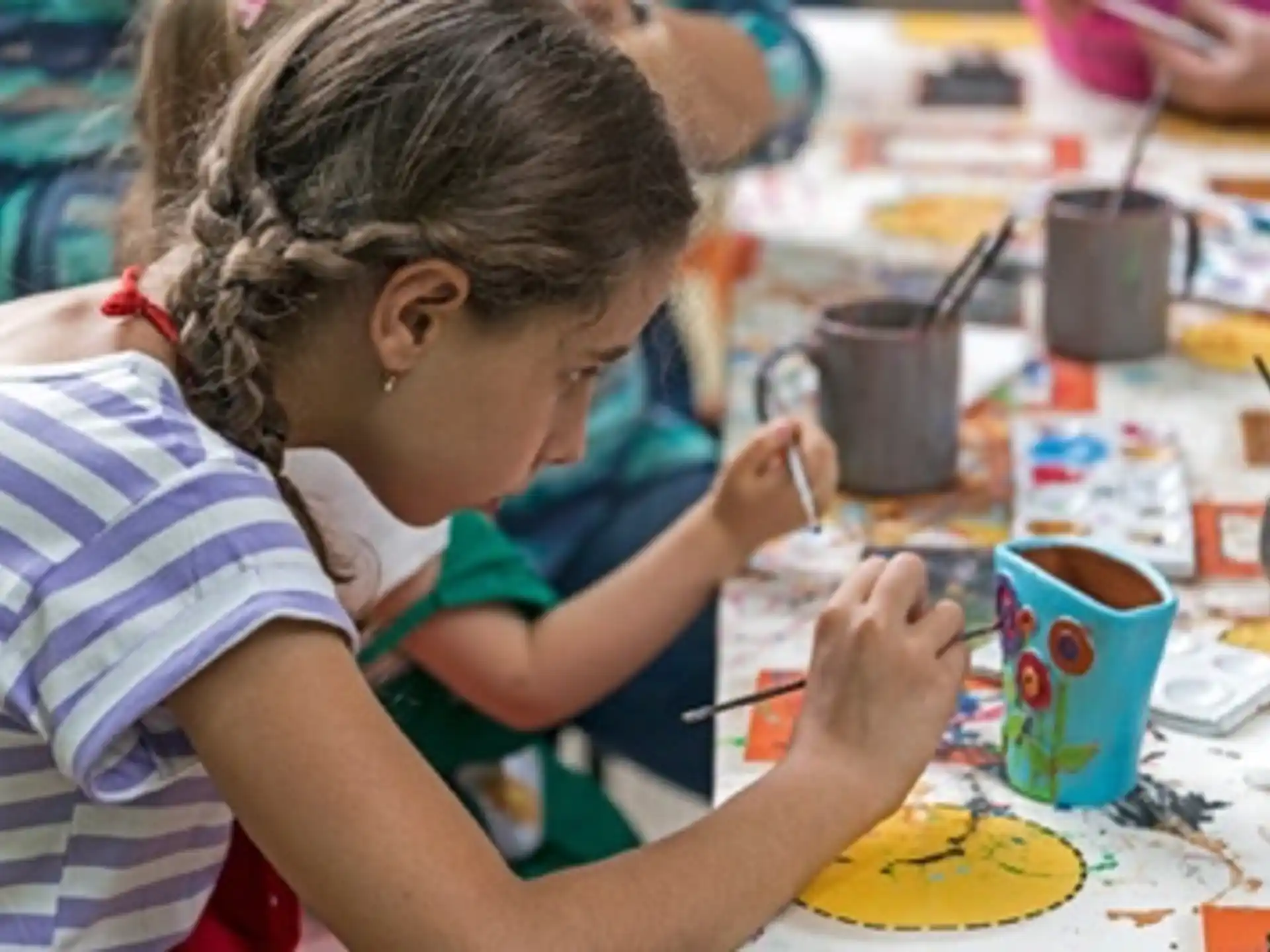 a young girl painting