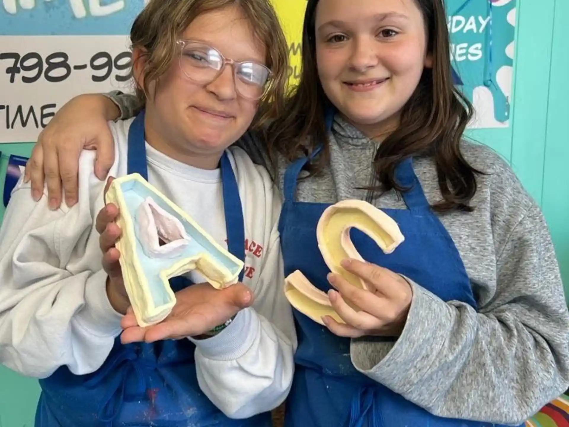 a couple of girls holding bananas