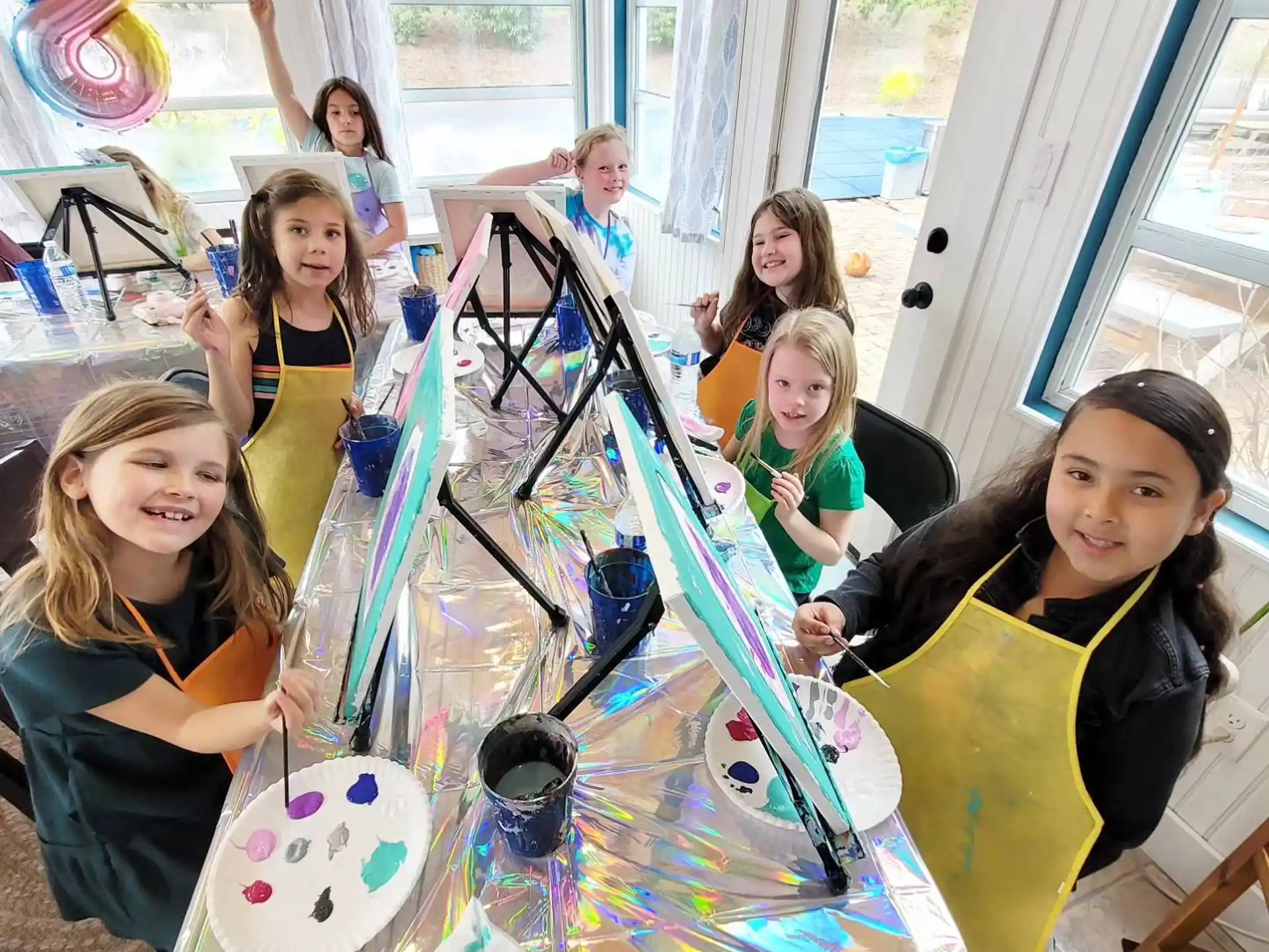 a group of children playing on a table