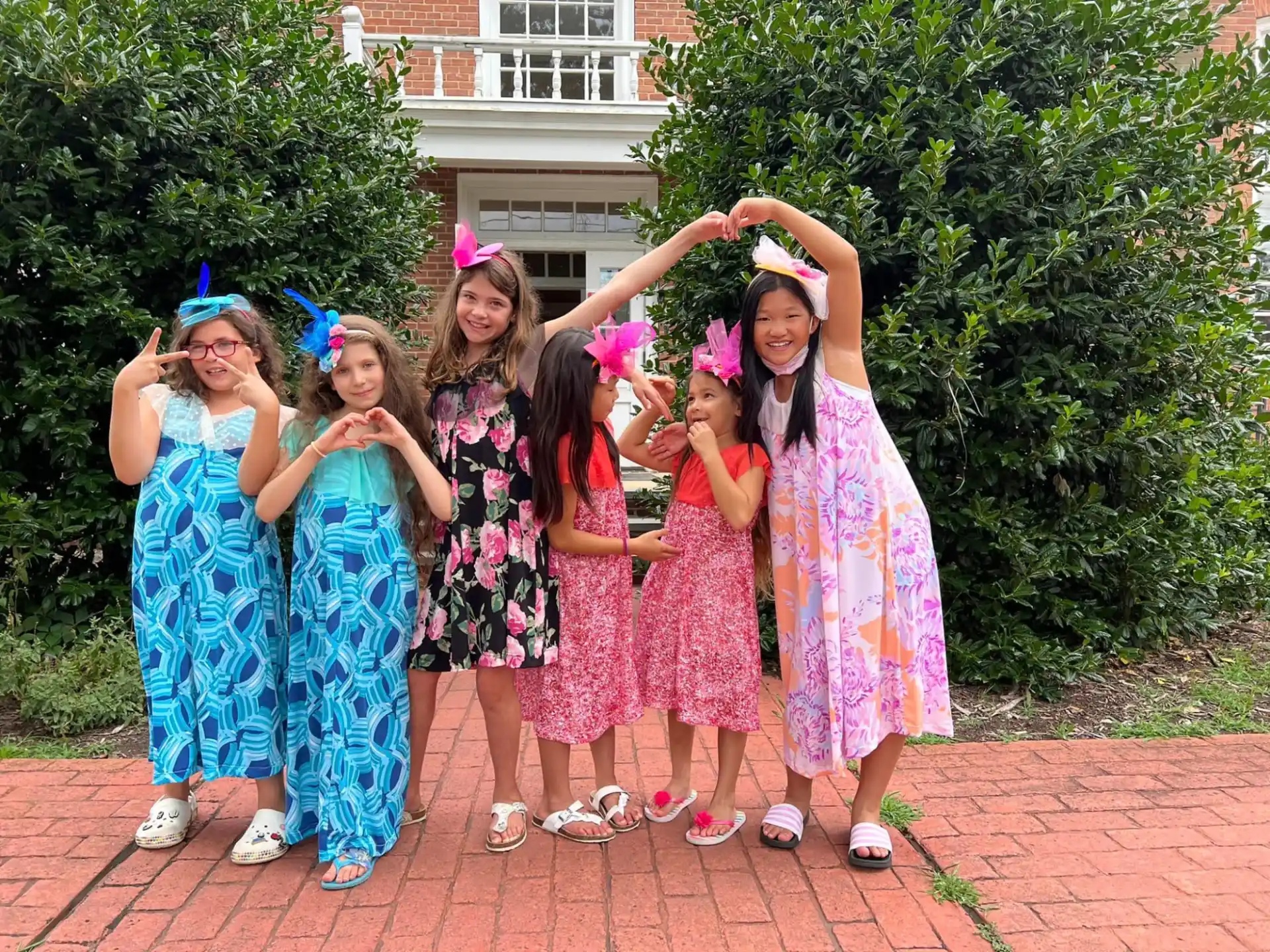 a group of girls wearing party hats